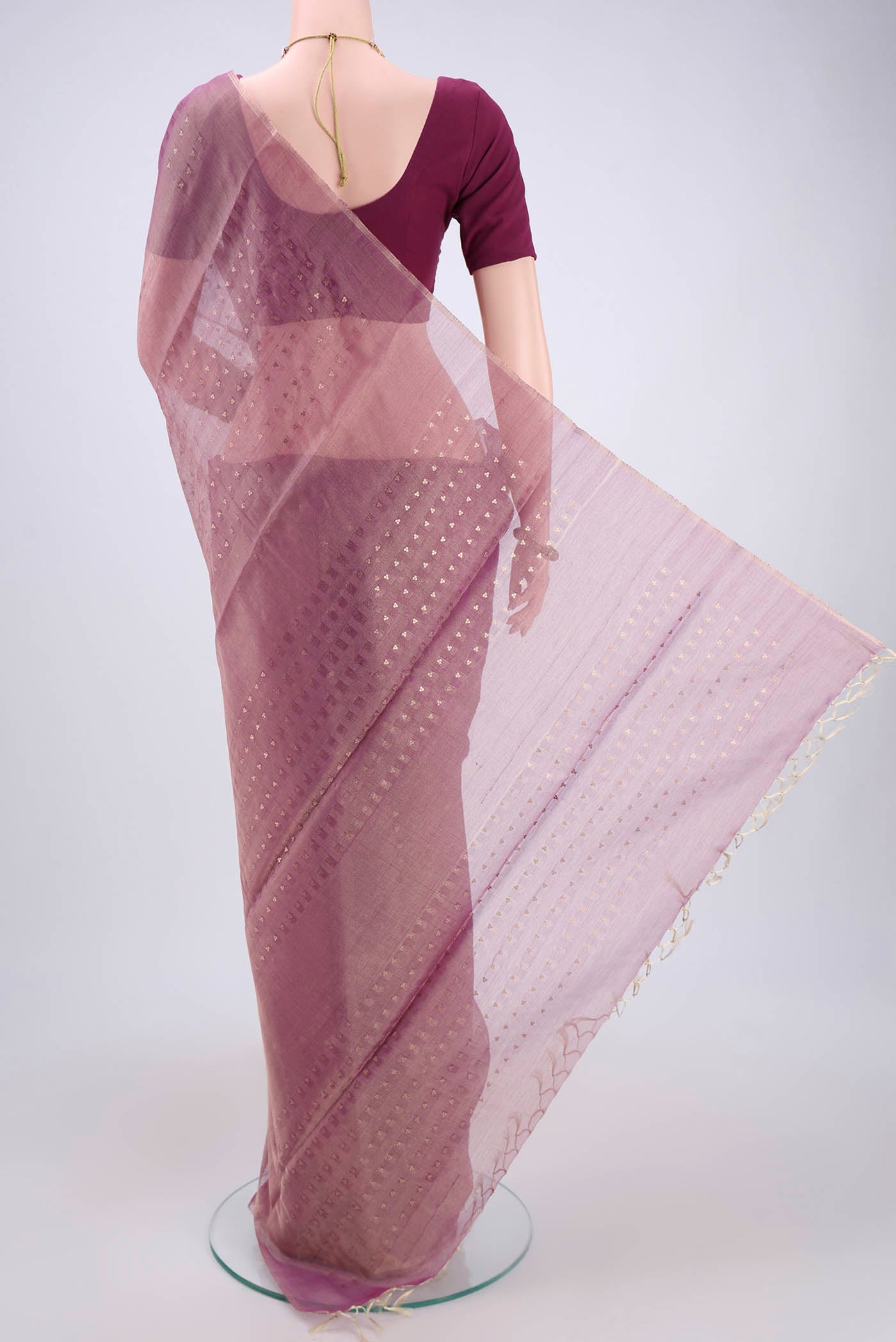Flat view of Purple MP Tussar Saree with Zari Butta on the body and Zari Border. 