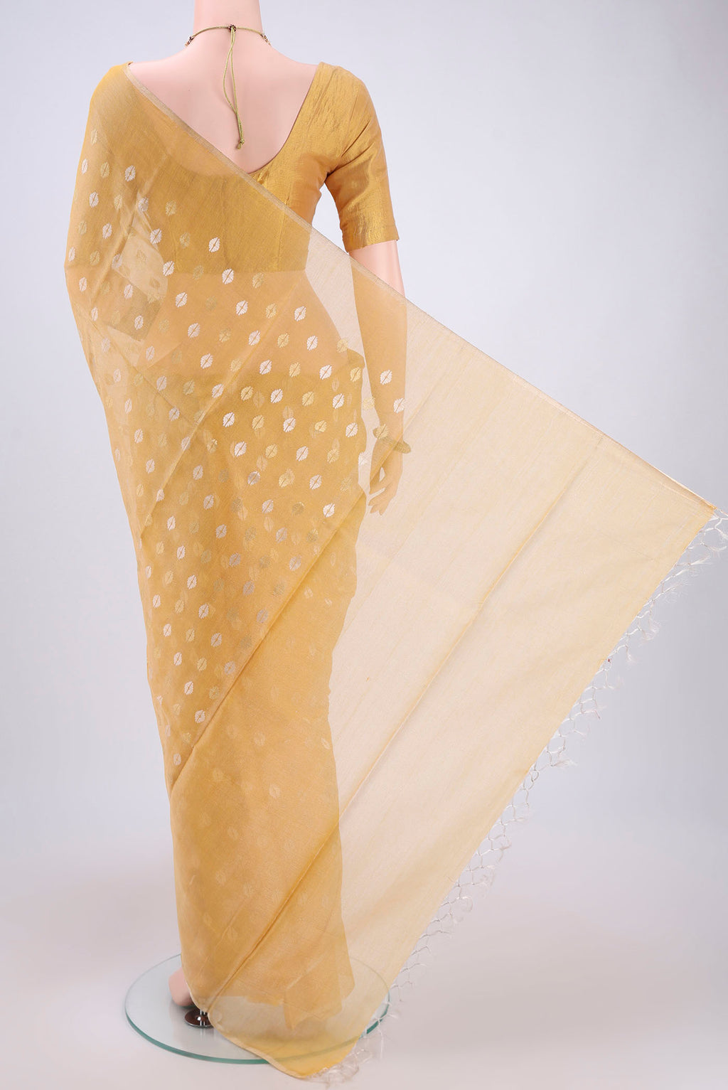 Flat view of Yellow MP Tussar Saree with Zari Butta on the body and Zari Border. 