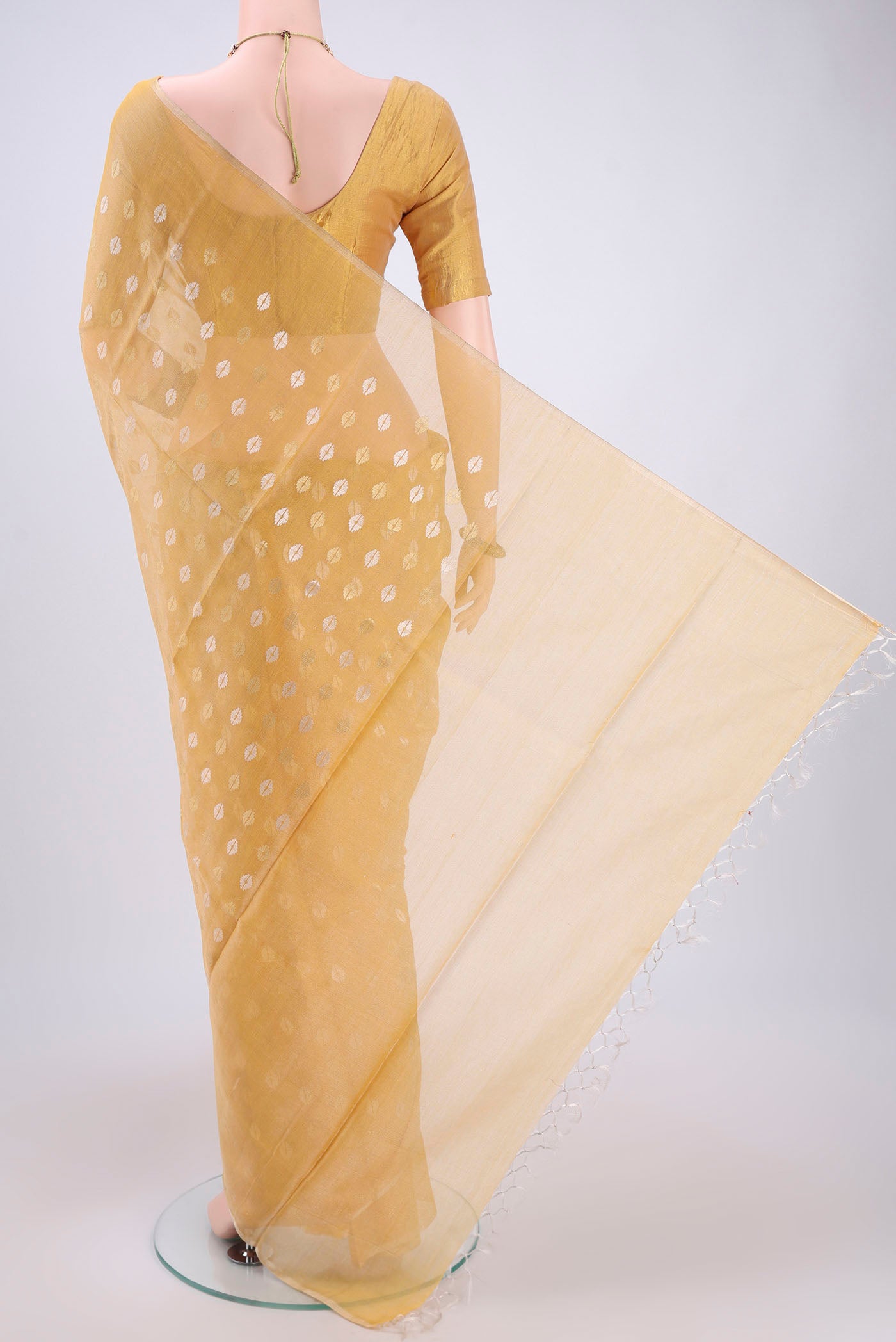 Flat view of Yellow MP Tussar Saree with Zari Butta on the body and Zari Border. 