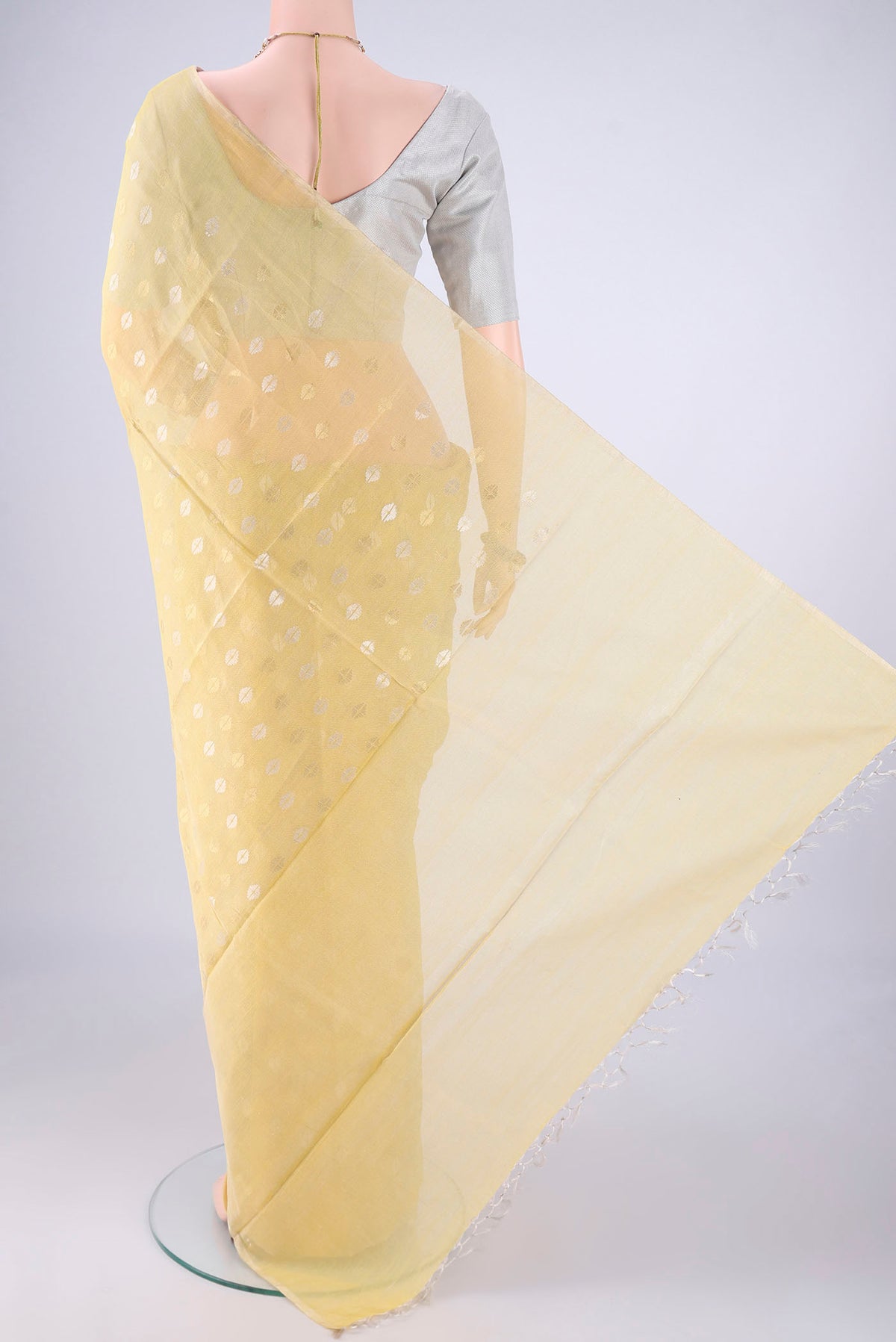Flat view of Lemon Yellow MP Tussar Saree with Zari Butta on the body and Thin Zari Line. 