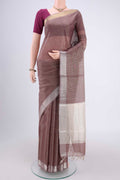 Maroon MP Tussar Saree with Zari Butta on the body and Zari Border.  displayed on a mannequin