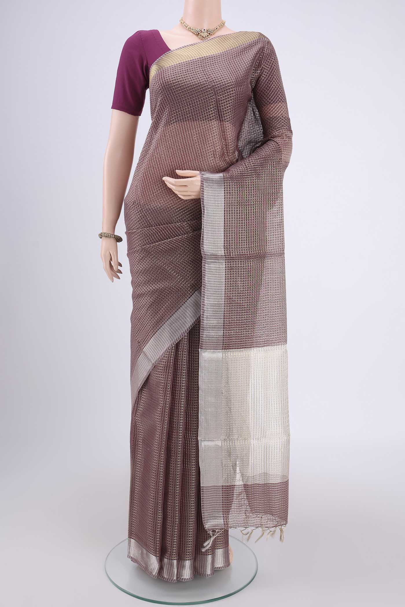 Maroon MP Tussar Saree with Zari Butta on the body and Zari Border.  displayed on a mannequin