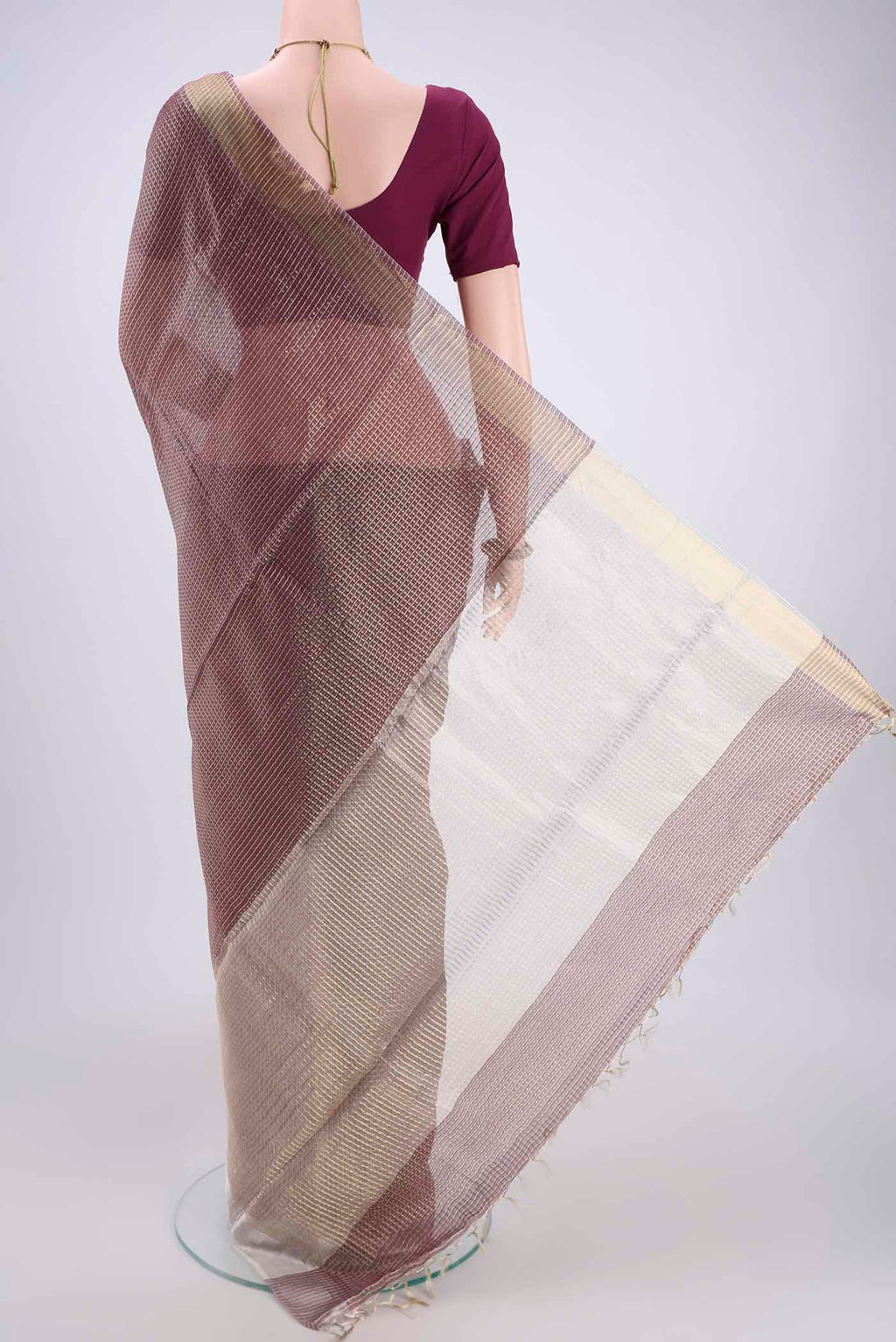 Flat view of Maroon MP Tussar Saree with Zari Butta on the body and Zari Border. 