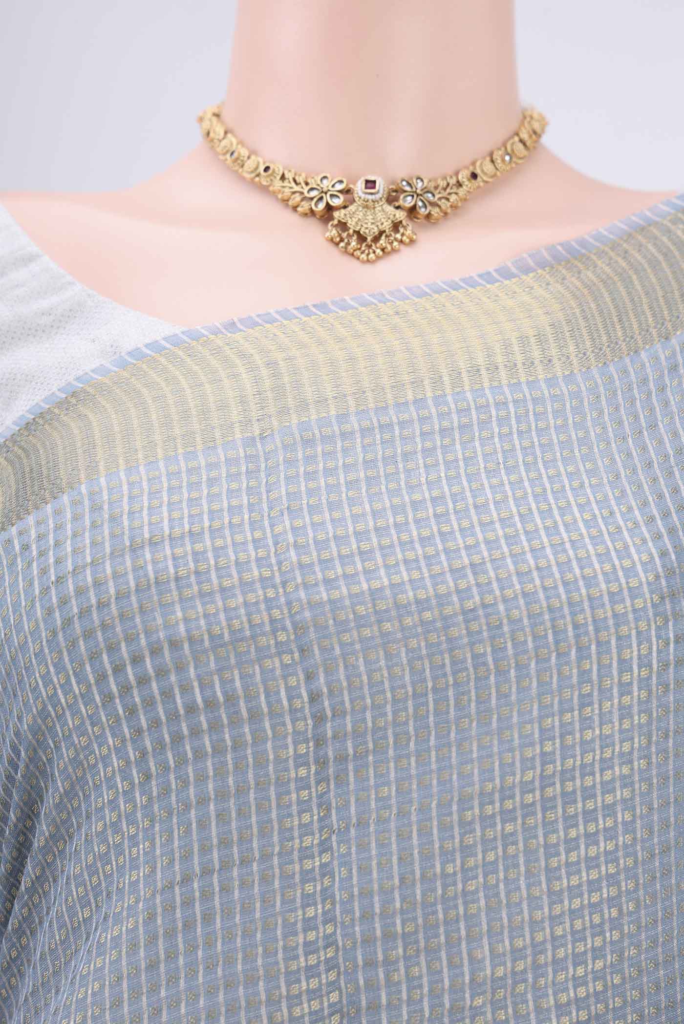 Border image of Blue MP Tussar Saree with Checked design on the body and Temple Border. 