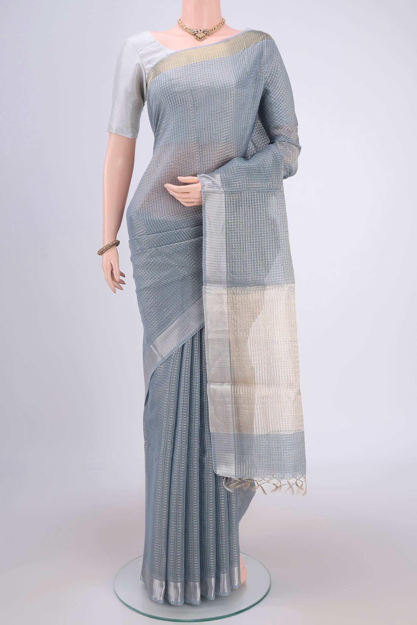 Blue MP Tussar Saree with Checked design on the body and Temple Border.  displayed on a mannequin