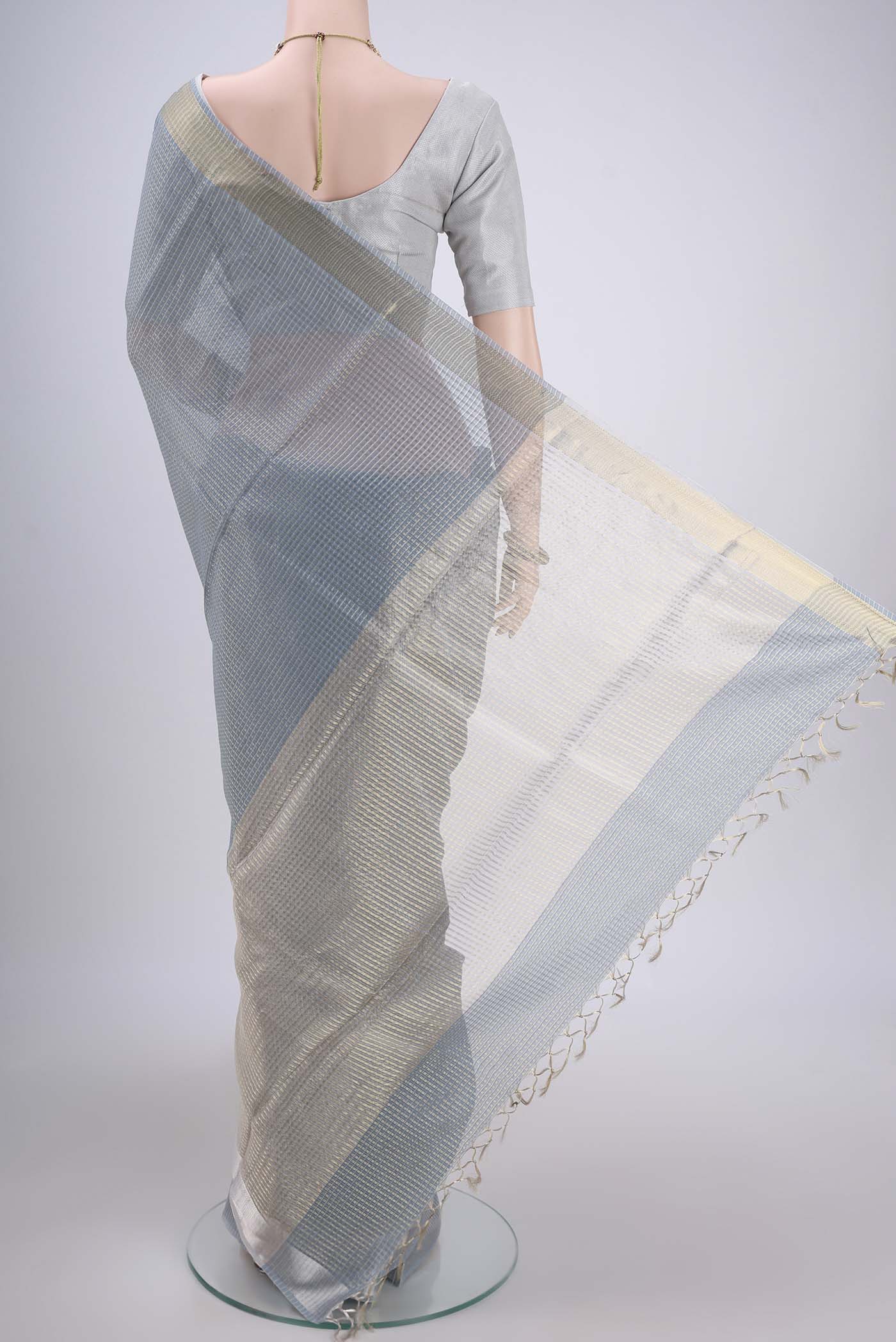 Flat view of Blue MP Tussar Saree with Checked design on the body and Temple Border. 