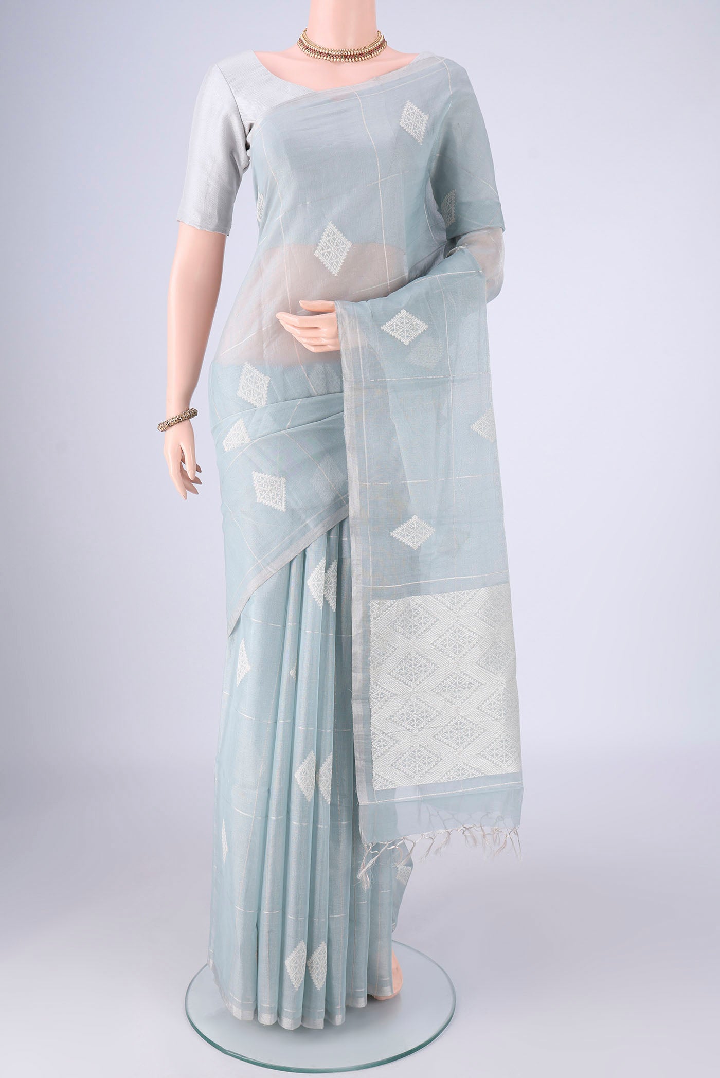 Sky Blue MP Tussar Saree with Checked design on the body and Thin Zari Line.  displayed on a mannequin