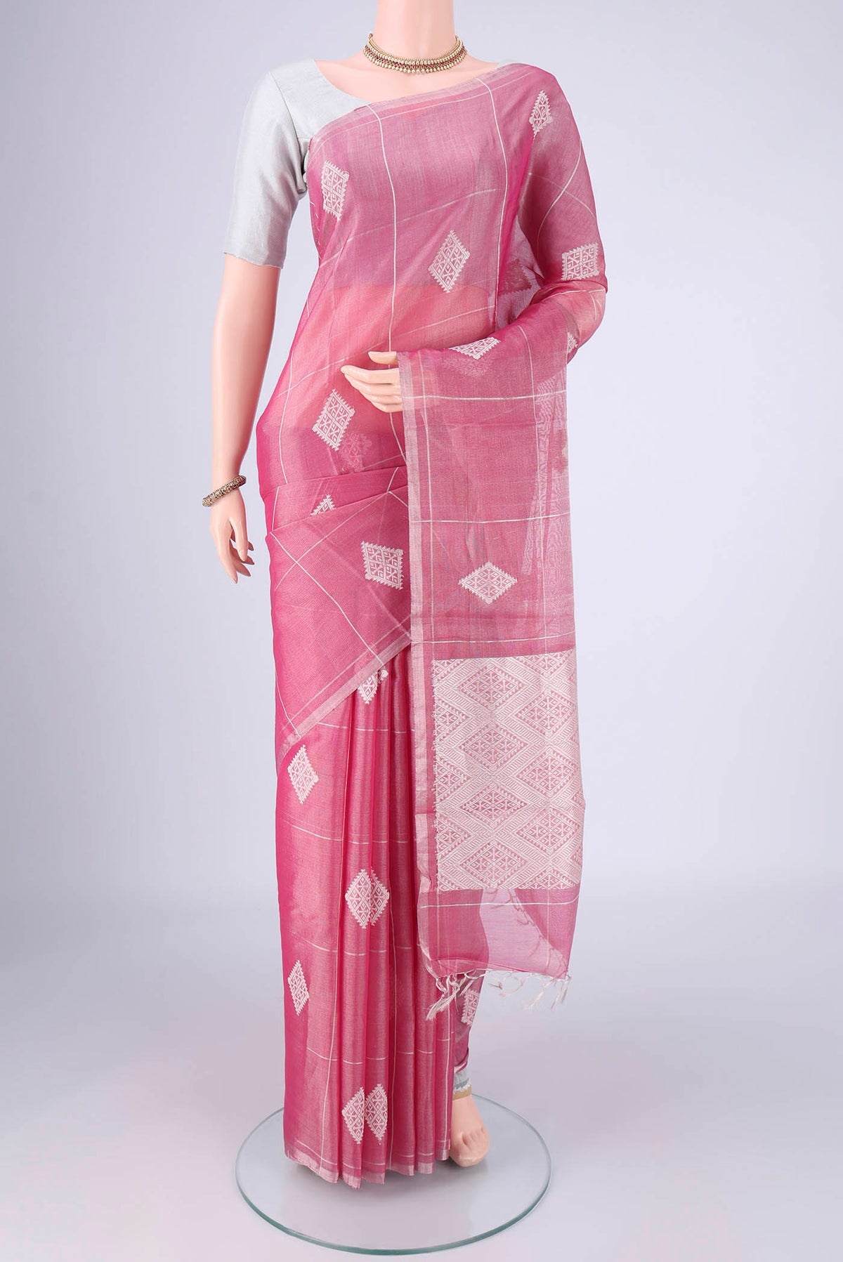 Pink MP Tussar Saree with Checked design on the body and Thin Zari Line.  displayed on a mannequin