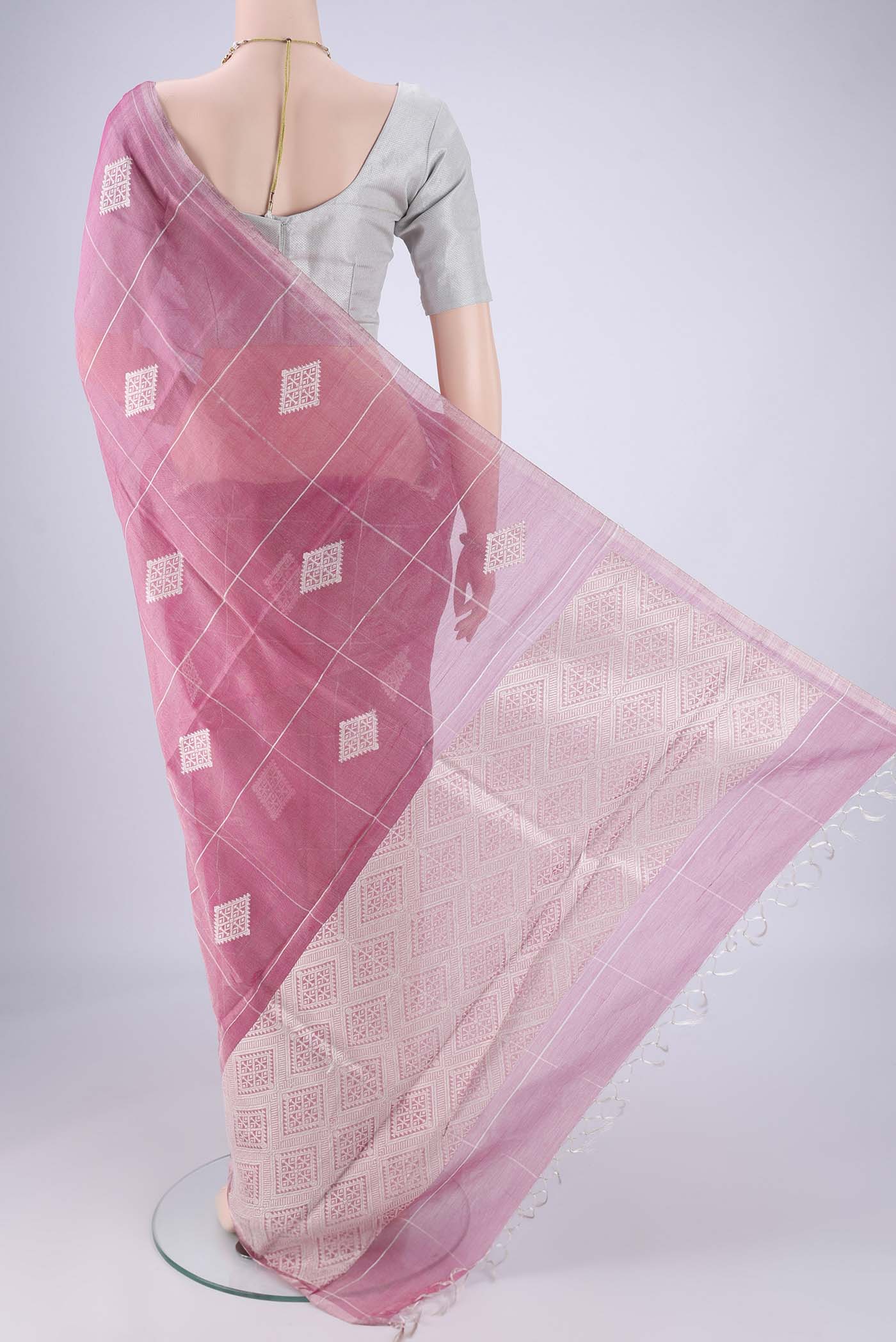 Flat view of Pink MP Tussar Saree with Checked design on the body and Thin Zari Line. 