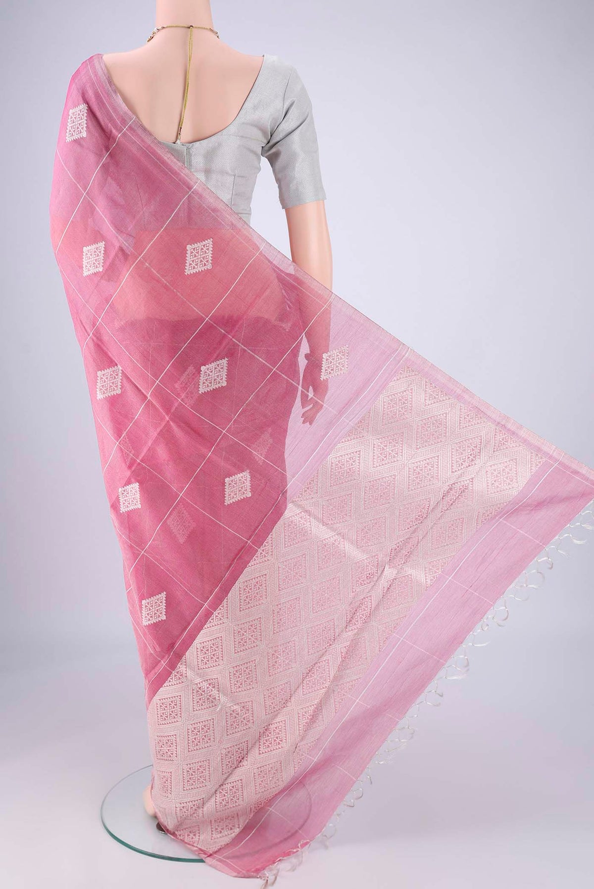 Flat view of Pink MP Tussar Saree with Checked design on the body and Thin Zari Line. 