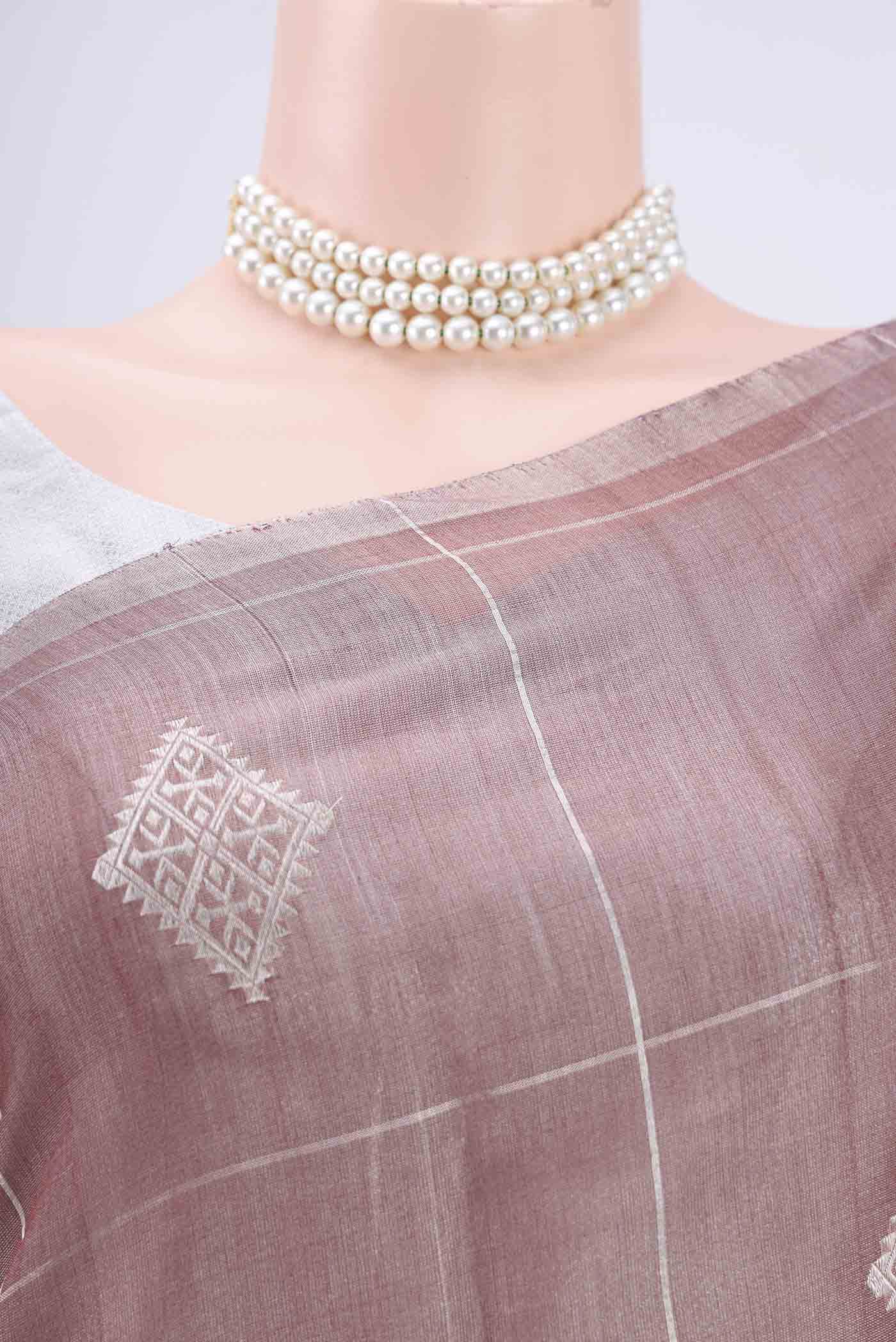 Border image of Mauve MP Tussar Saree with Zari Butta on the body and Zari Border. 