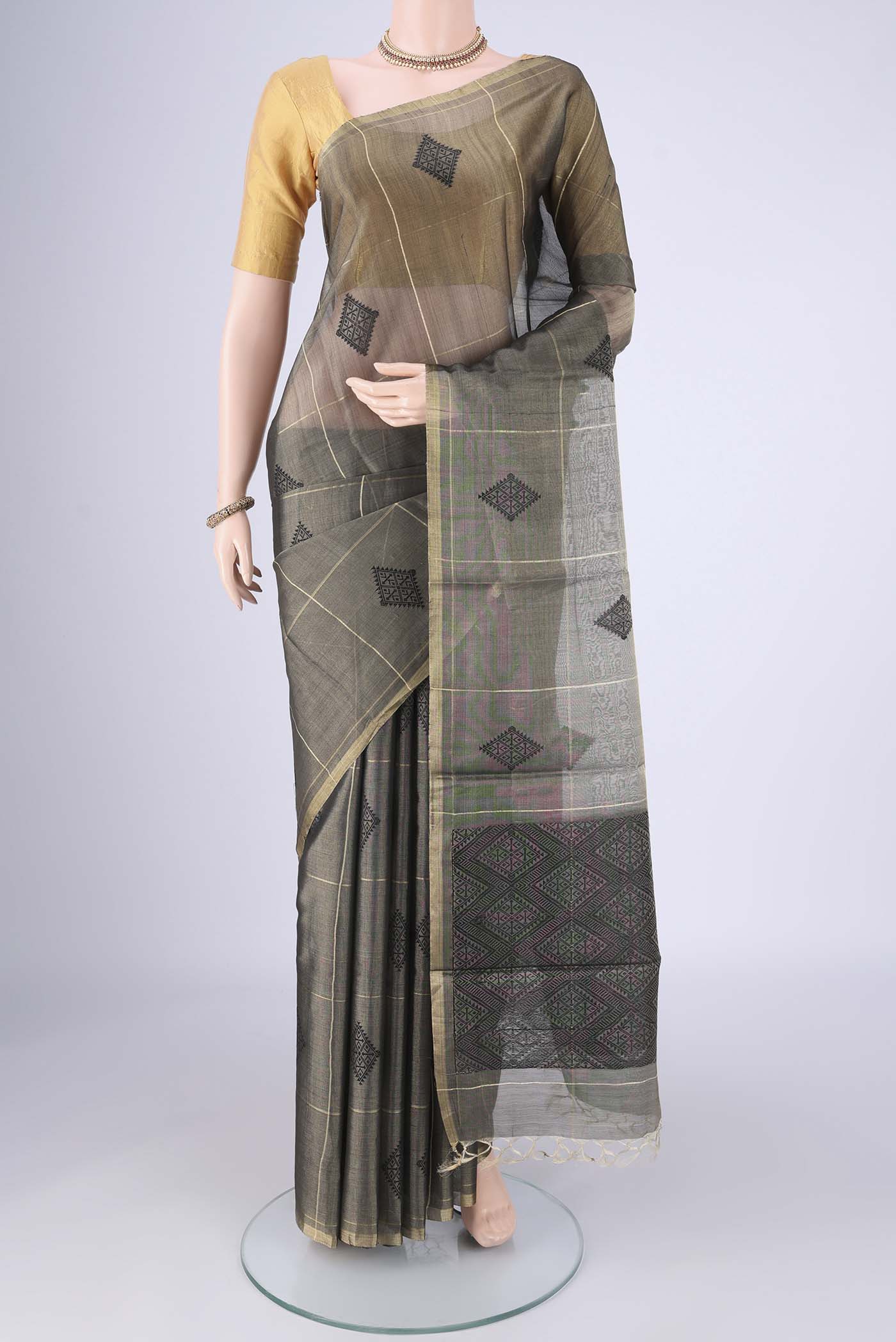 Davys Grey MP Tussar Saree with Checked design on the body and Thin Zari Line.  displayed on a mannequin