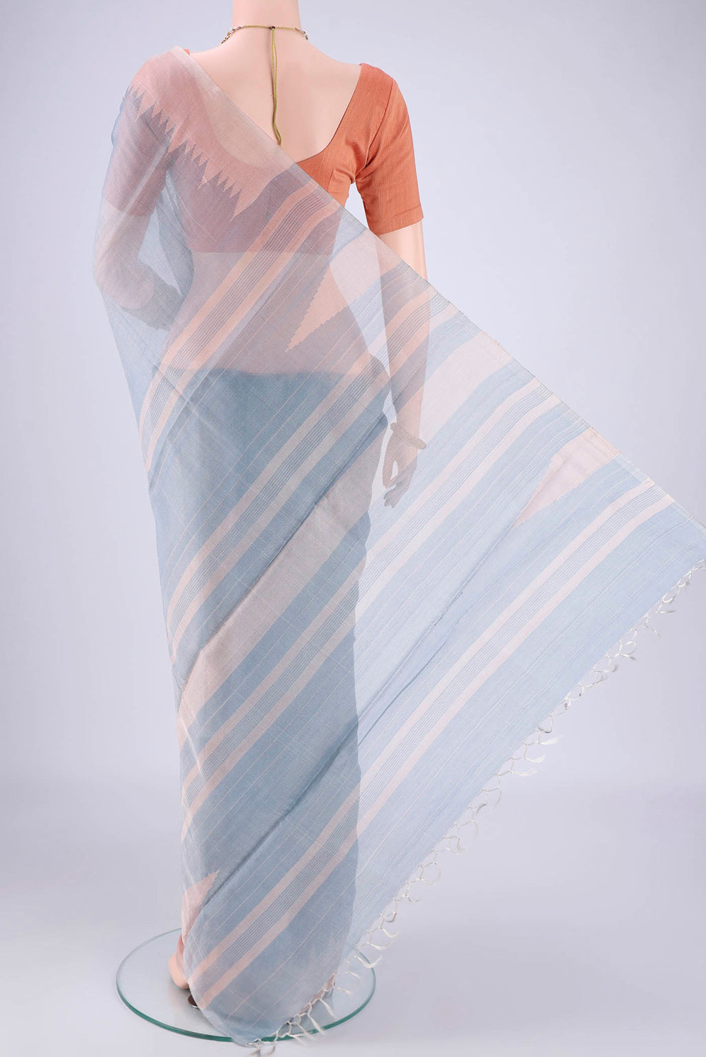 Flat view of Sky Blue MP Tussar Saree with Plain Body and Temple Border. 
