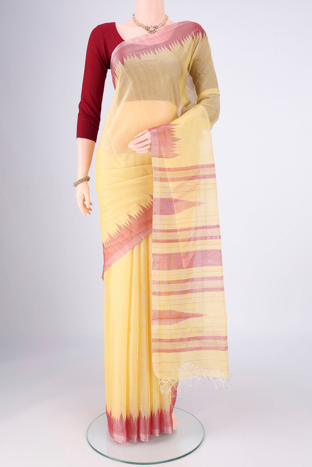 Lemon Yellow MP Tussar Saree with Plain Body and Zari Border.  displayed on a mannequin