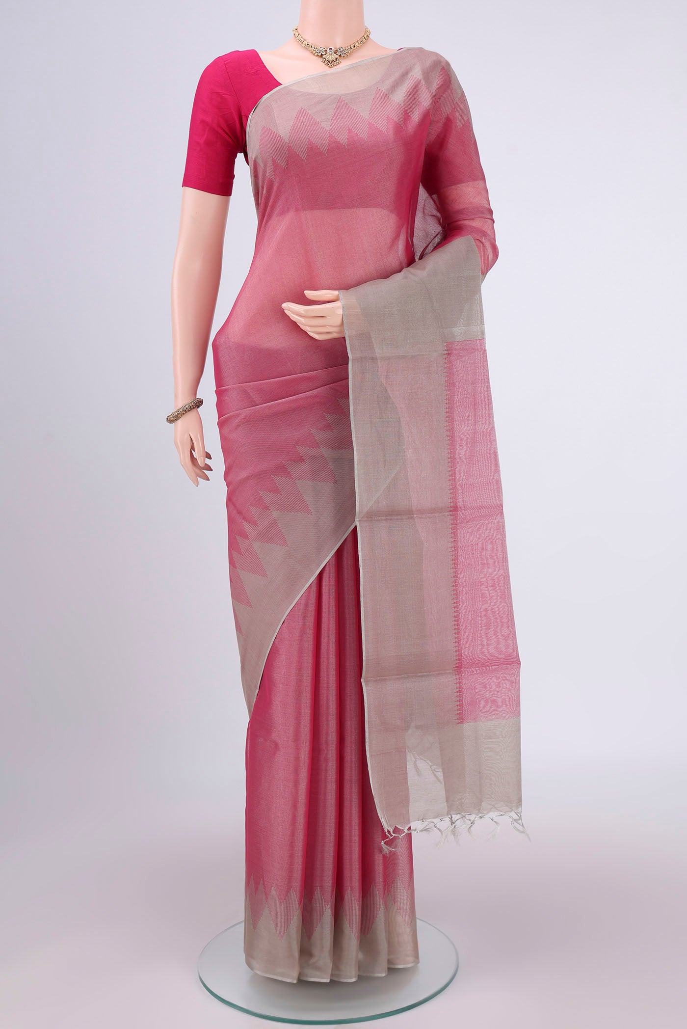Pink MP Tussar Saree with Plain Body and Temple Border.  displayed on a mannequin