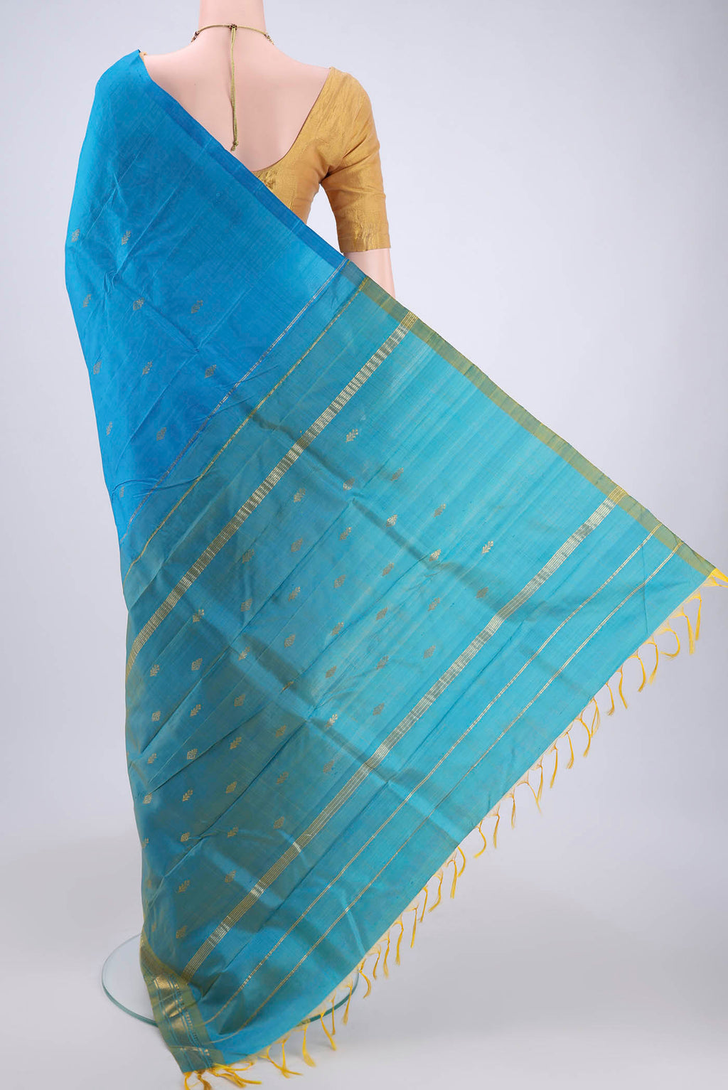 Flat view of Blue Kanchipuram Silk Saree with Zari Butta on the body and One Side Border. 