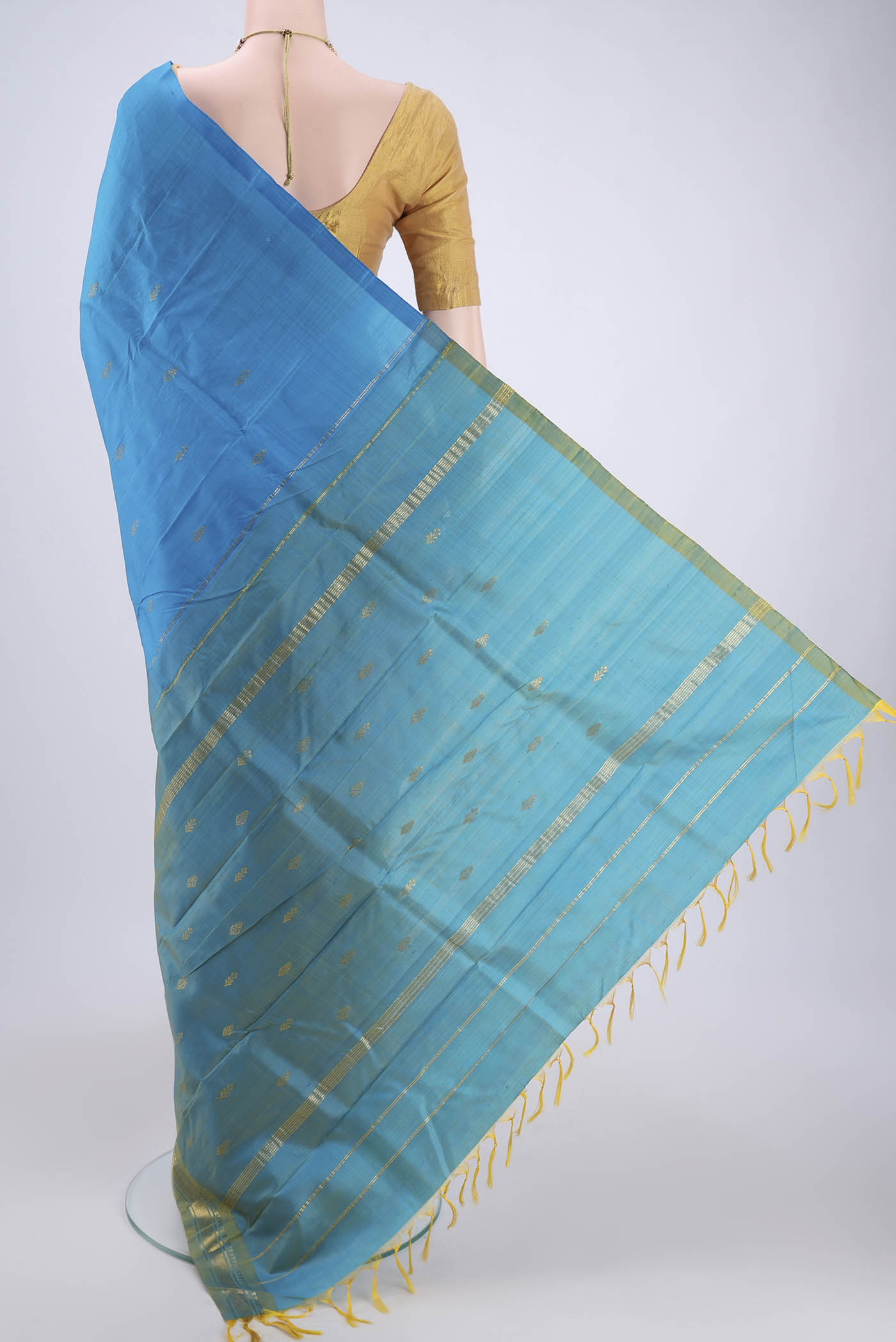 Flat view of Blue Kanchipuram Silk Saree with Zari Butta on the body and One Side Border. 