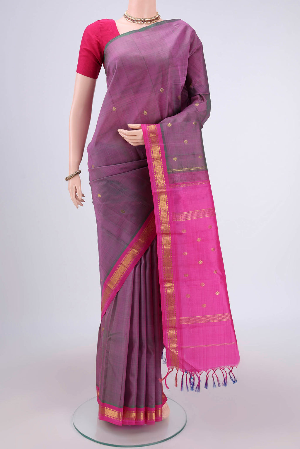 Light Magenta Kanchipuram Silk Saree with Zari Butta on the body and One Side Border.  displayed on a mannequin