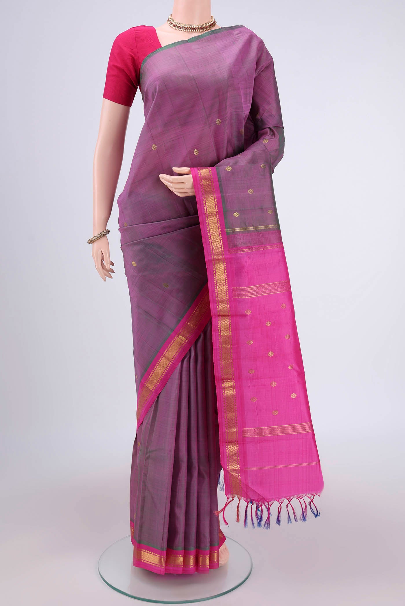 Light Magenta Kanchipuram Silk Saree with Zari Butta on the body and One Side Border.  displayed on a mannequin
