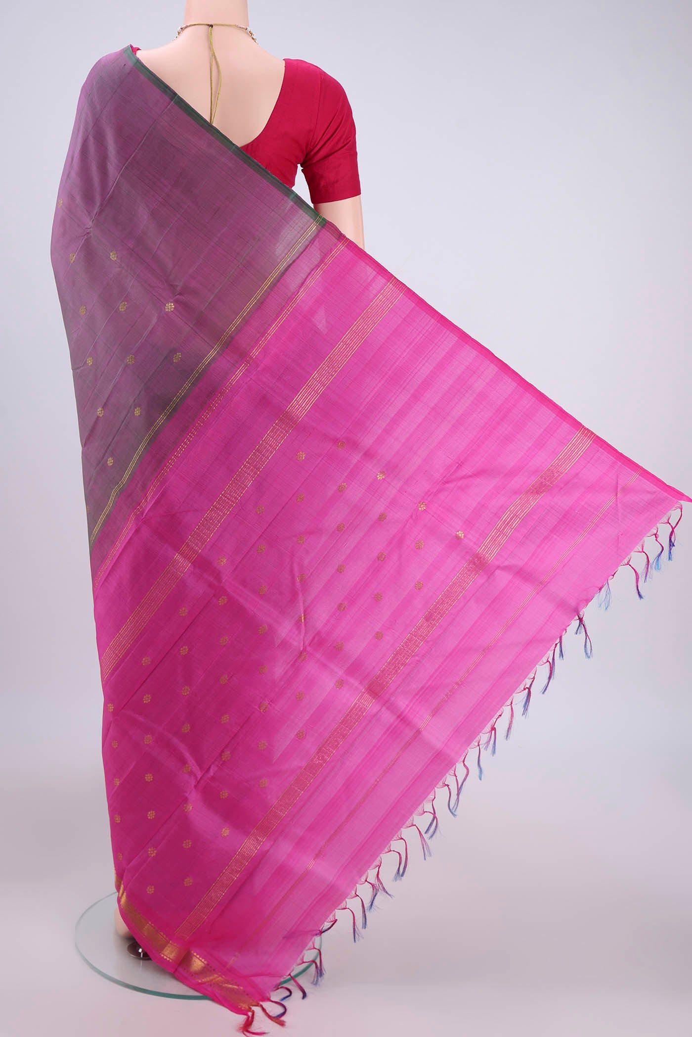 Flat view of Light Magenta Kanchipuram Silk Saree with Zari Butta on the body and One Side Border. 