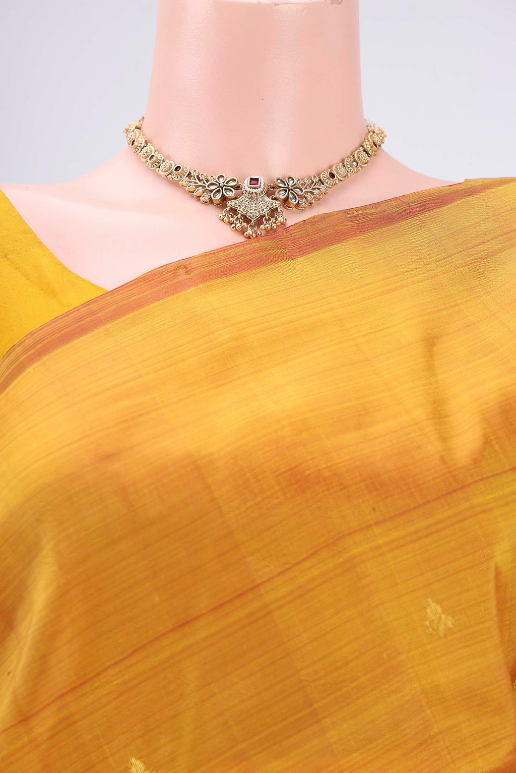 Border image of Yellow Kanchipuram Silk Saree with Zari Butta on the body and One Side Border. 