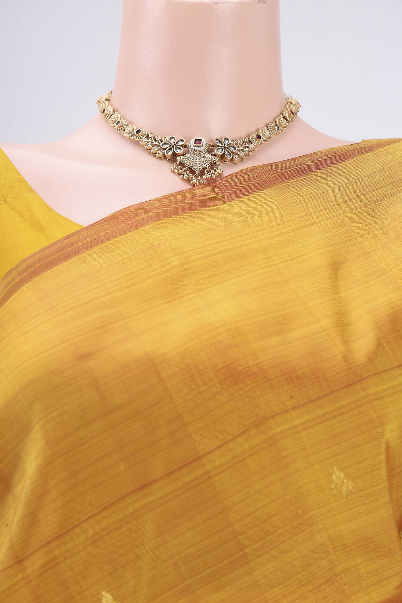 Border image of Yellow Kanchipuram Silk Saree with Zari Butta on the body and One Side Border. 
