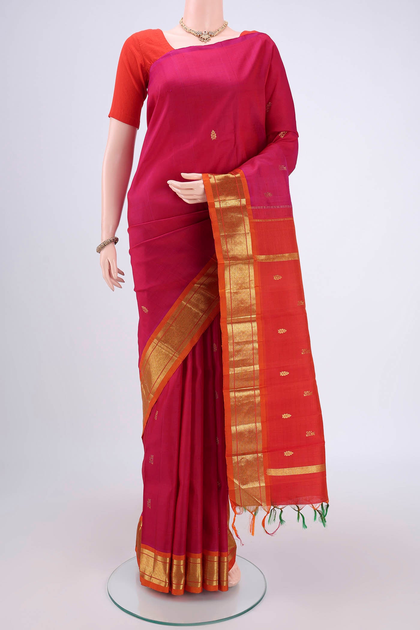 Pink Kanjivaram Silk Saree with Zari Butta on the body and One Side Border.  displayed on a mannequin