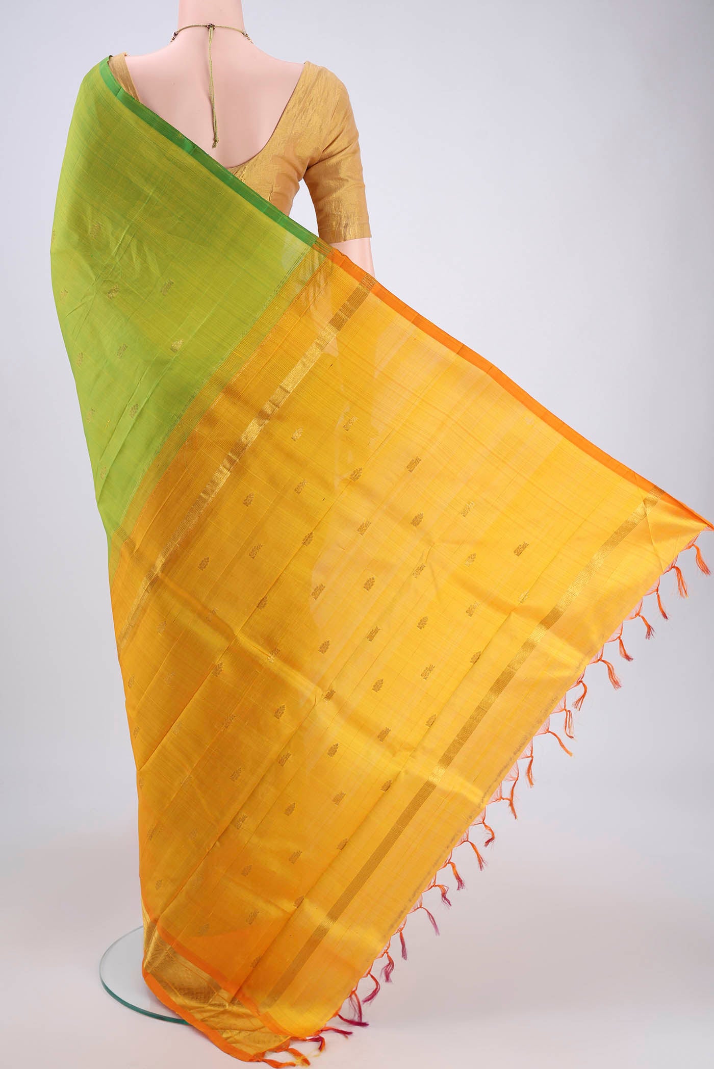 Flat view of Green Kanjivaram Silk Saree with Zari Butta on the body and One Side Border. 