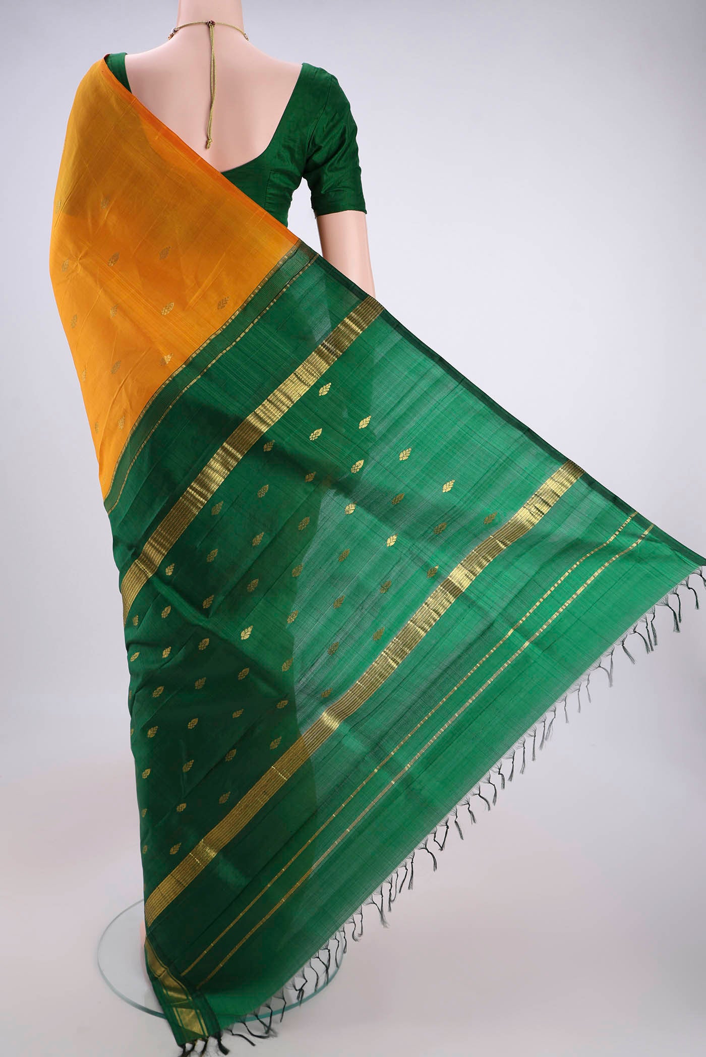 Flat view of Yellow Kanjivaram Silk Saree with Zari Butta on the body and One Side Border. 