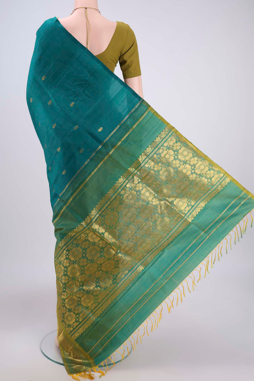 Flat view of Green Kanjivaram Silk Saree with Zari Butta on the body and One Side Border. 