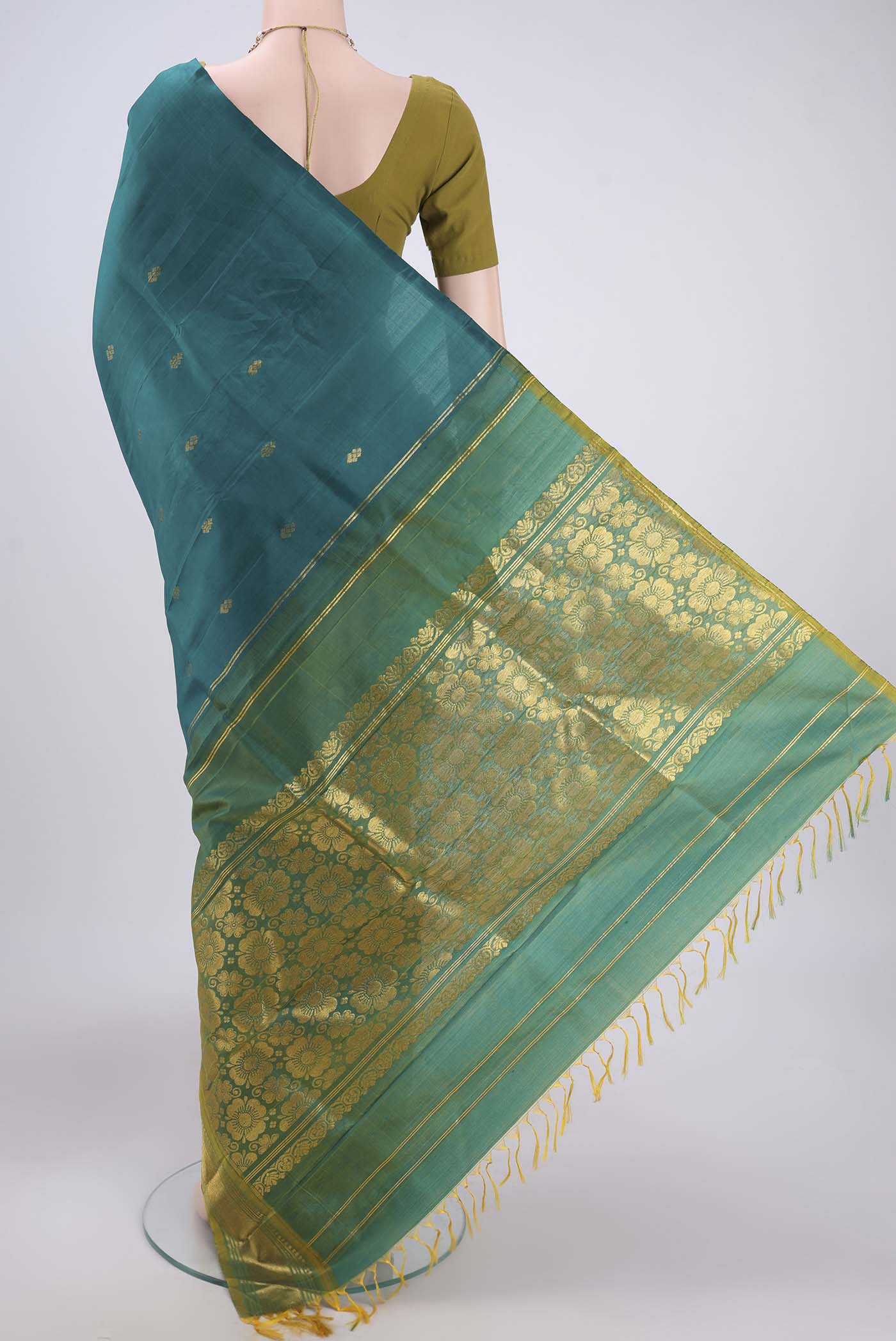 Flat view of Green Kanjivaram Silk Saree with Zari Butta on the body and One Side Border. 