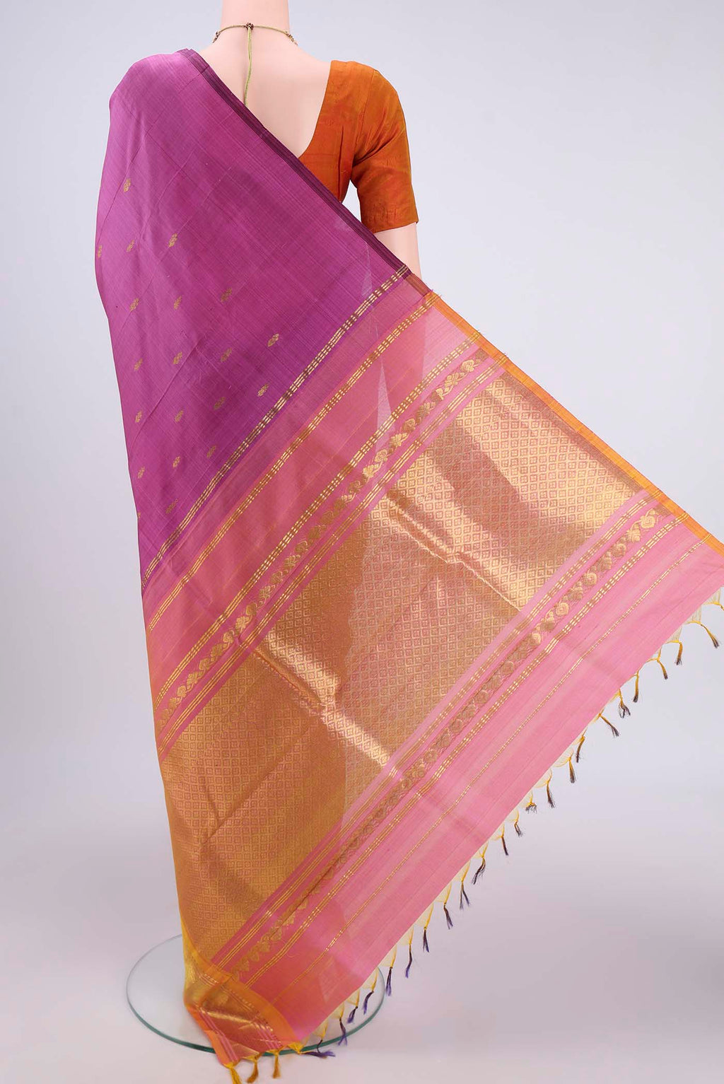 Flat view of Magenta Kanjivaram Silk Saree with Zari Butta on the body and One Side Border. 