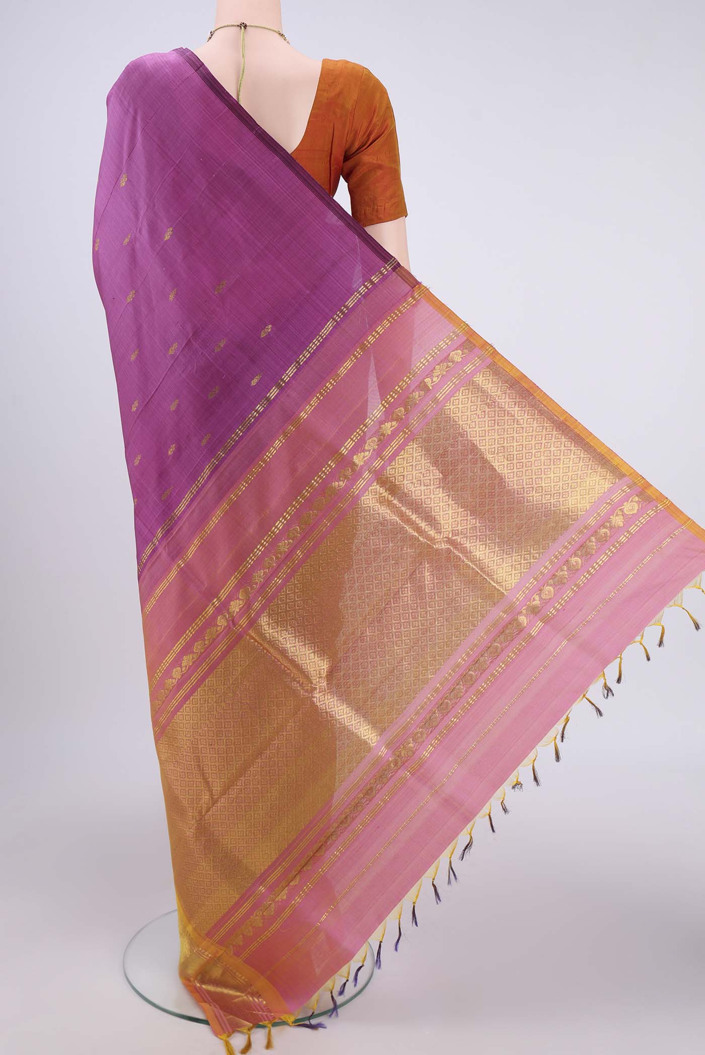 Flat view of Magenta Kanjivaram Silk Saree with Zari Butta on the body and One Side Border. 