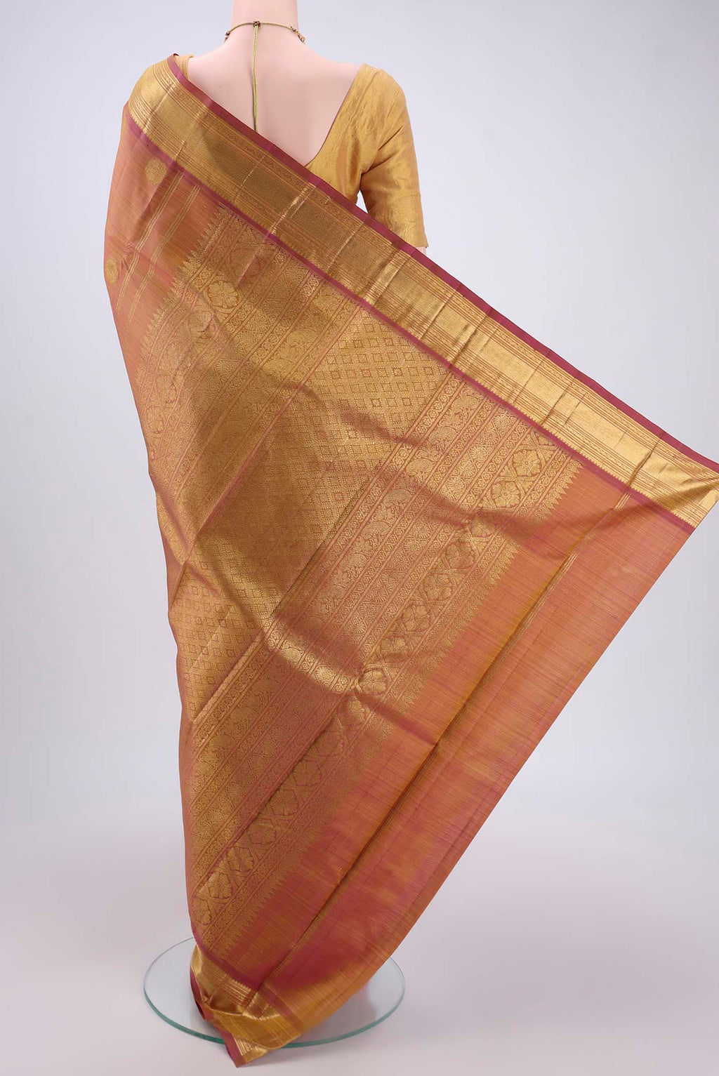 Flat view of Pure Silk Pure Zari Magenta Kanchipuram Saree with Zari Butta on the body and Zari Border. 