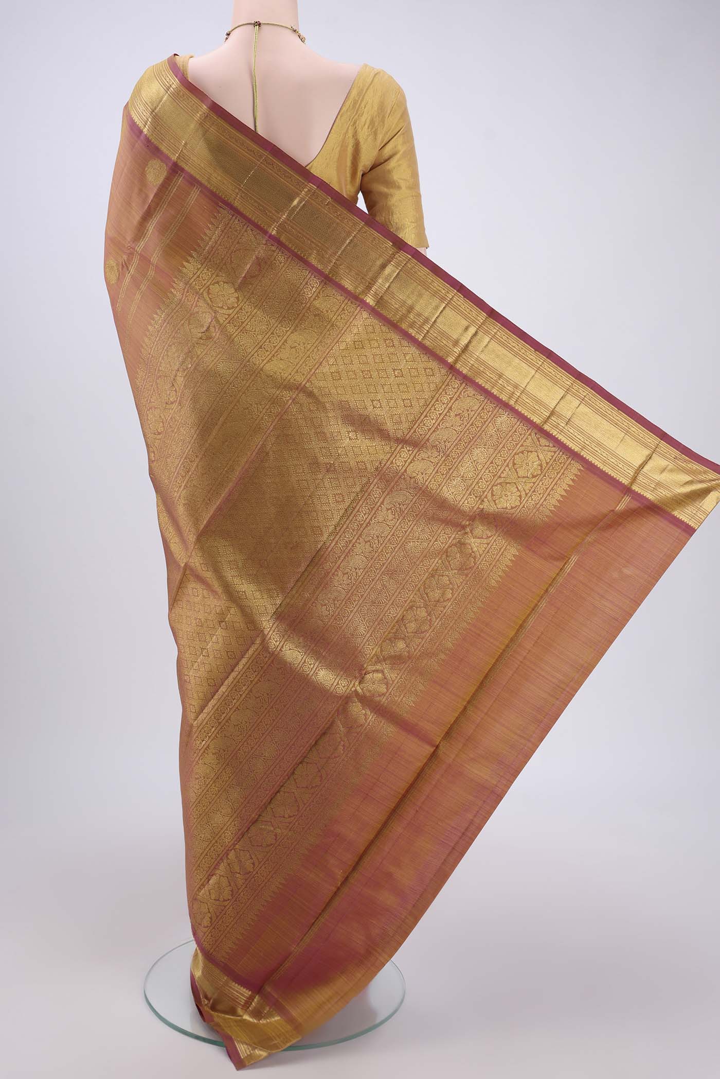 Flat view of Pure Silk Pure Zari Magenta Kanchipuram Saree with Zari Butta on the body and Zari Border. 
