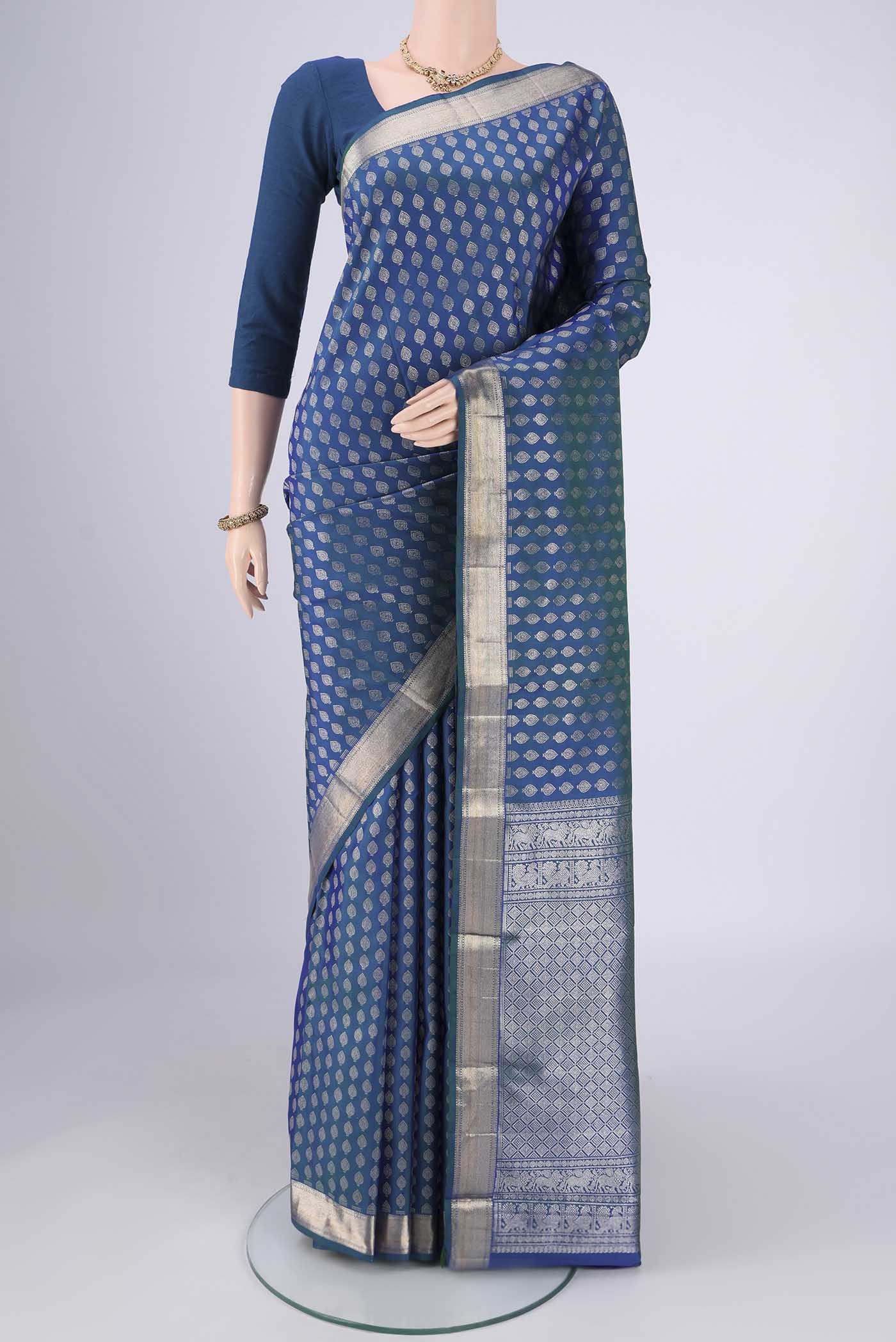 Blue Dual Tone Kanchipuram Silk Saree with Zari Butta on the body and Zari Border.  displayed on a mannequin