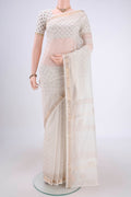 Off White Maheshwari Silk Cotton Saree with Batik Print on the body and Zari Border.  displayed on a mannequin