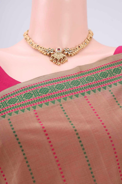 Border image of Beige Coimbatore Cotton Saree with Stripes on the body and Thread Border. 