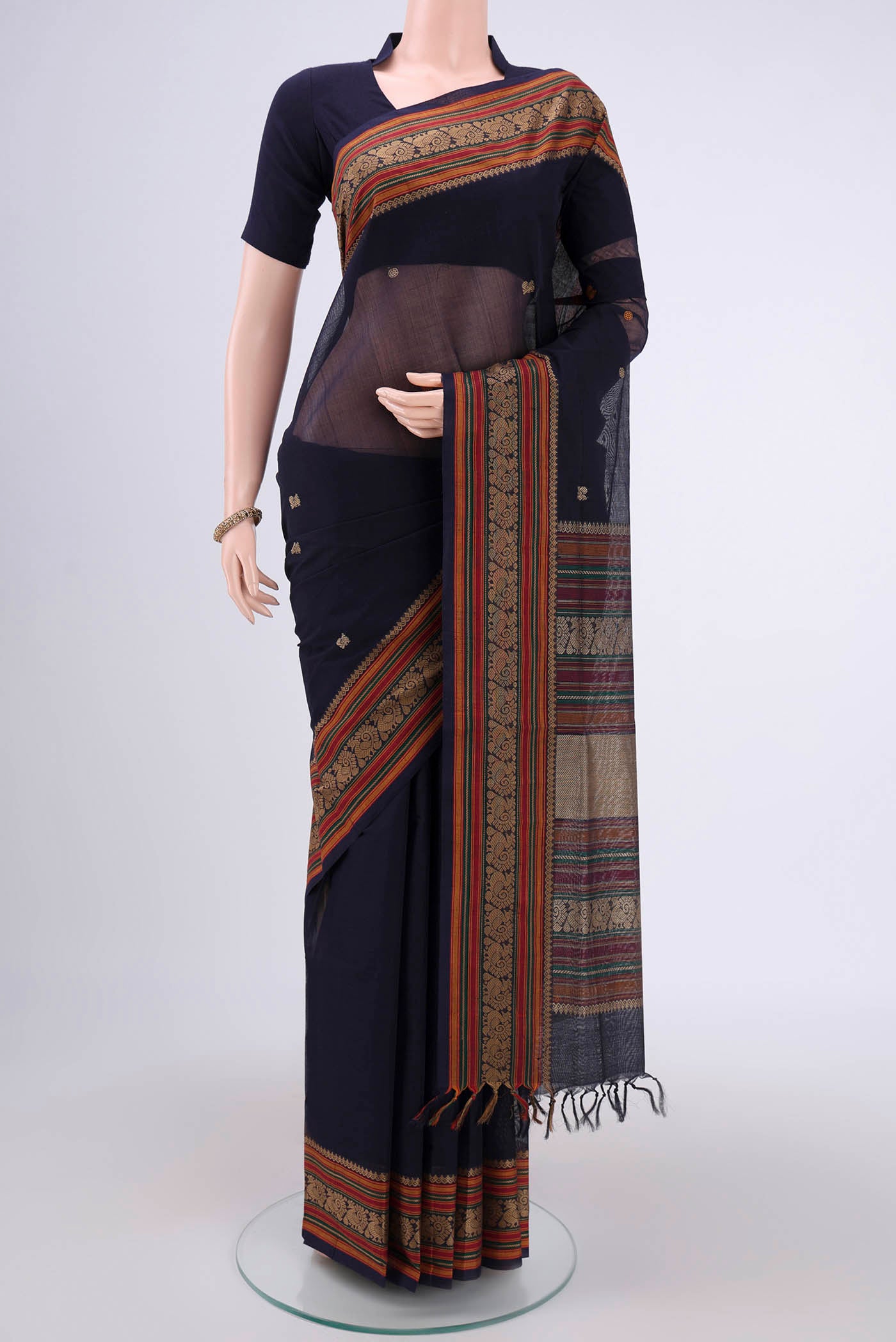 Navy Blue Coimbatore Cotton Saree with Stripes on the body and Thread Border.  displayed on a mannequin