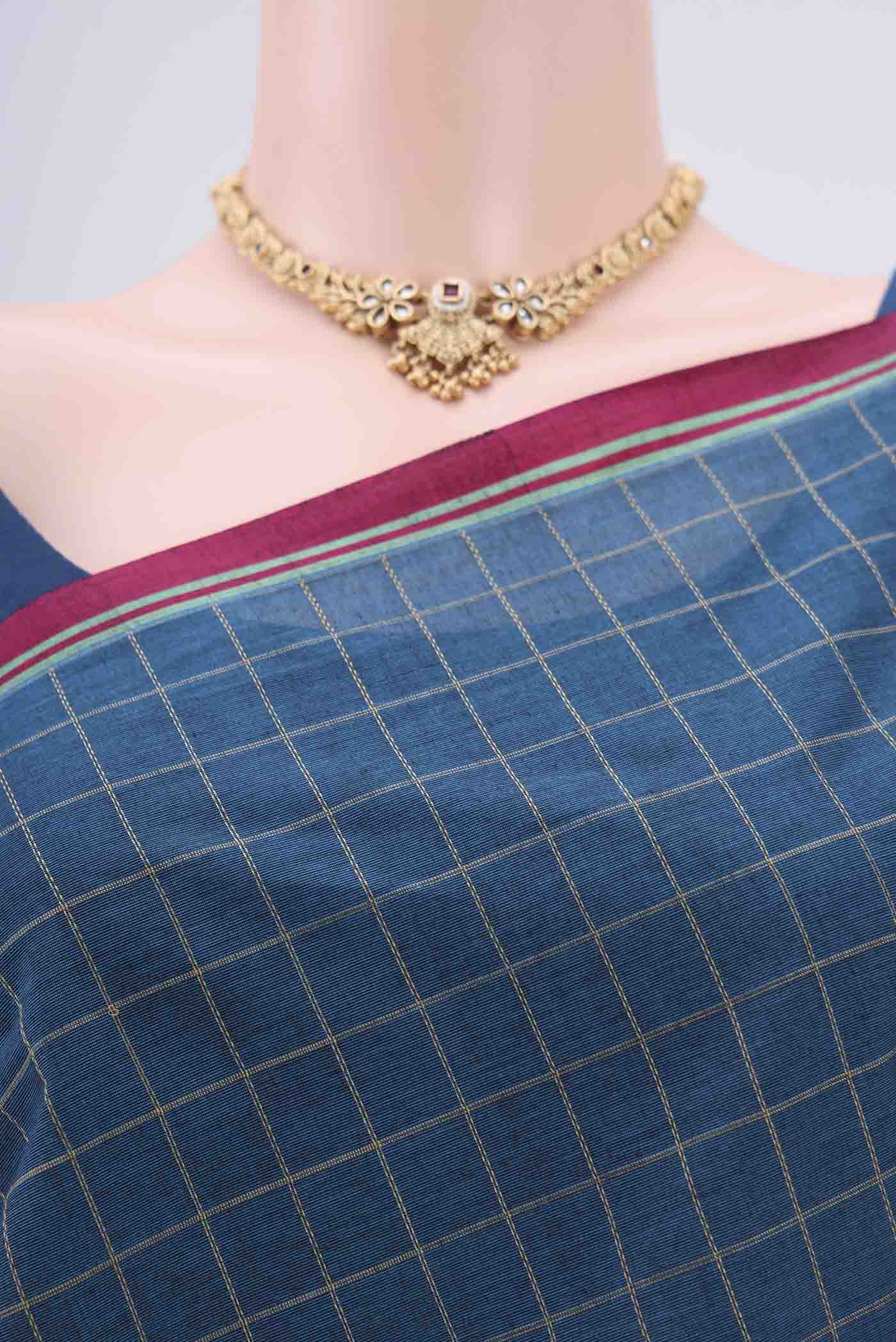 Border image of Turquoise Coimbatore Cotton Saree with Stripes on the body and Thread Border. 