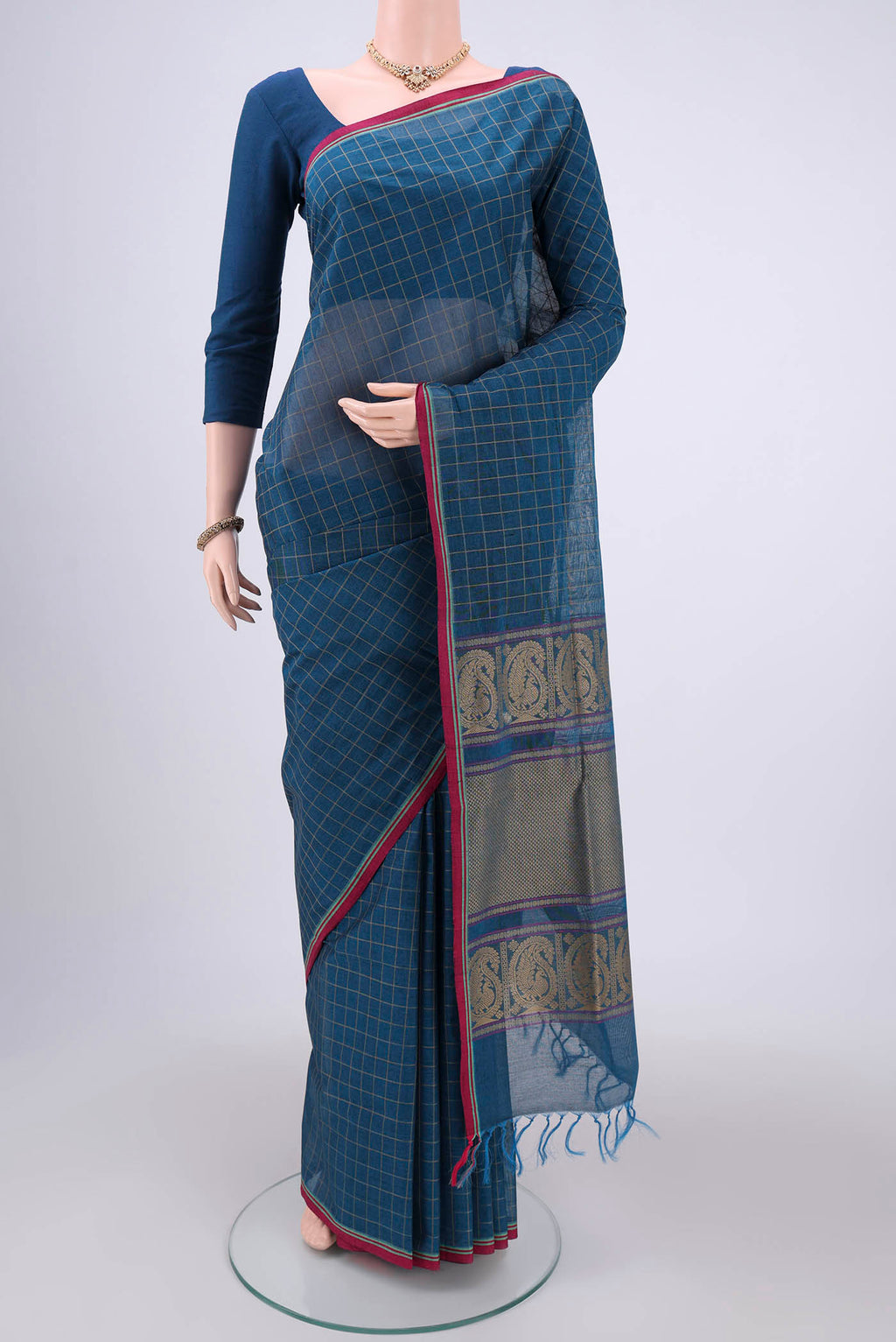Turquoise Coimbatore Cotton Saree with Stripes on the body and Thread Border.  displayed on a mannequin