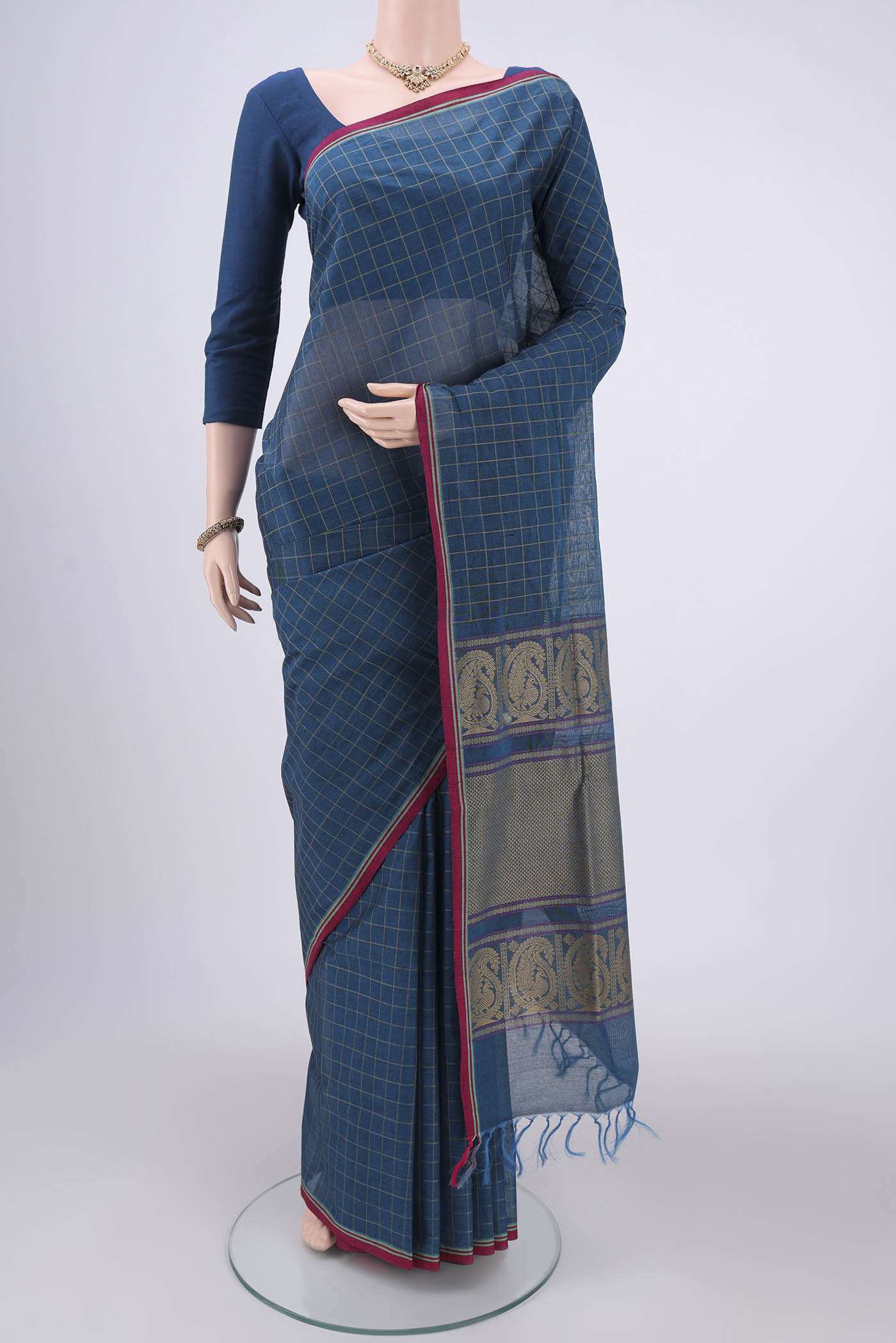 Turquoise Coimbatore Cotton Saree with Stripes on the body and Thread Border.  displayed on a mannequin