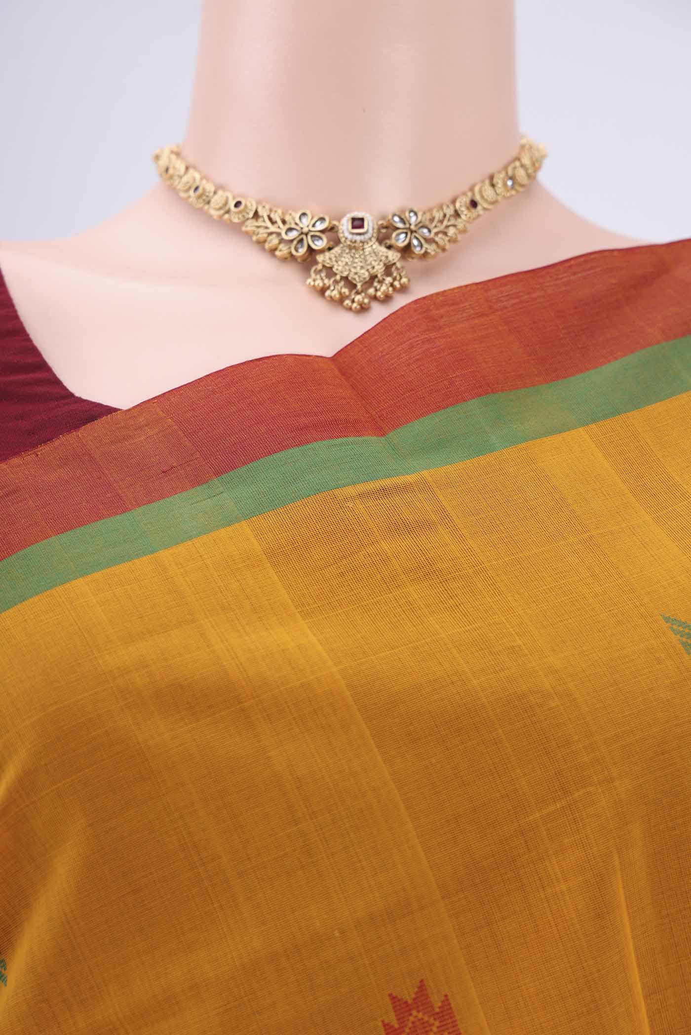 Border image of Mustard Coimbatore Cotton Saree with Stripes on the body and Thread Border. 