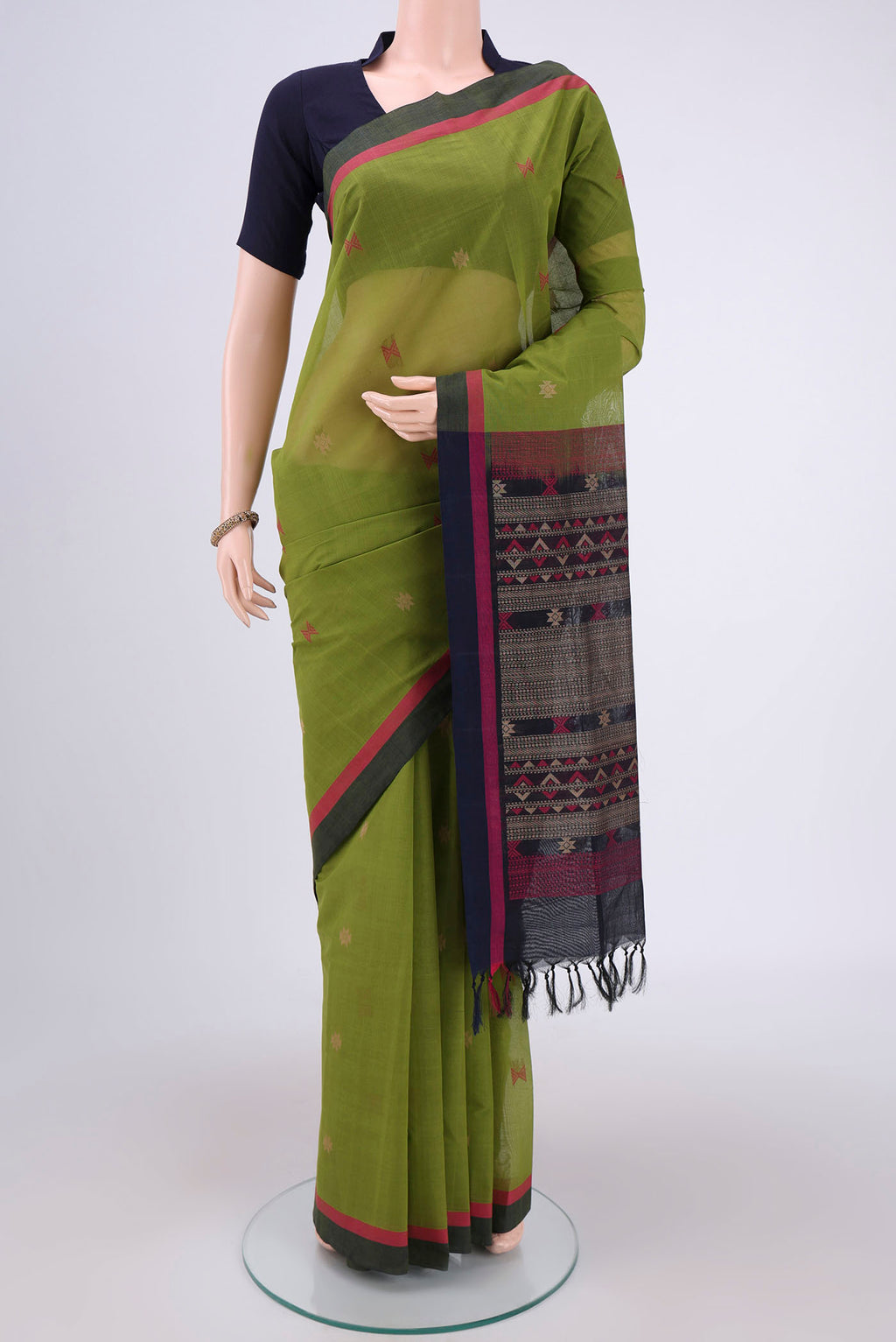 Mehandi Green Coimbatore Cotton Saree with Stripes on the body and Thread Border.  displayed on a mannequin