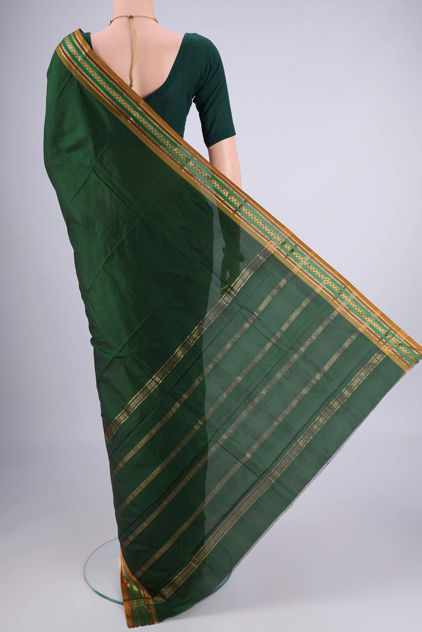 Flat view of Bottle Green Blended Bangalore Silk Saree with Jacquard design on the body and Zari Border. 