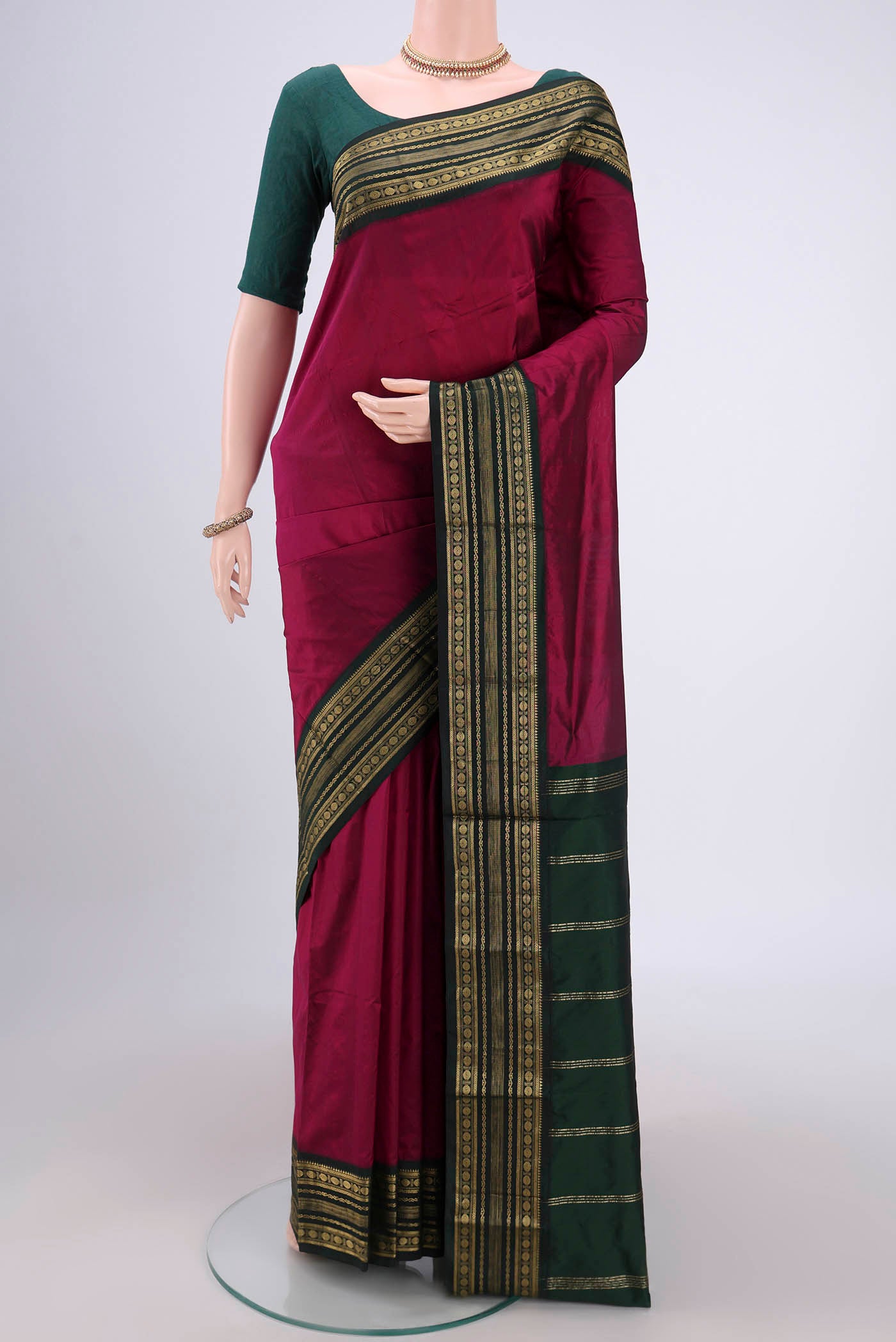 Magenta Blended Bangalore Silk Saree with Plain Body and Zari Border.  displayed on a mannequin
