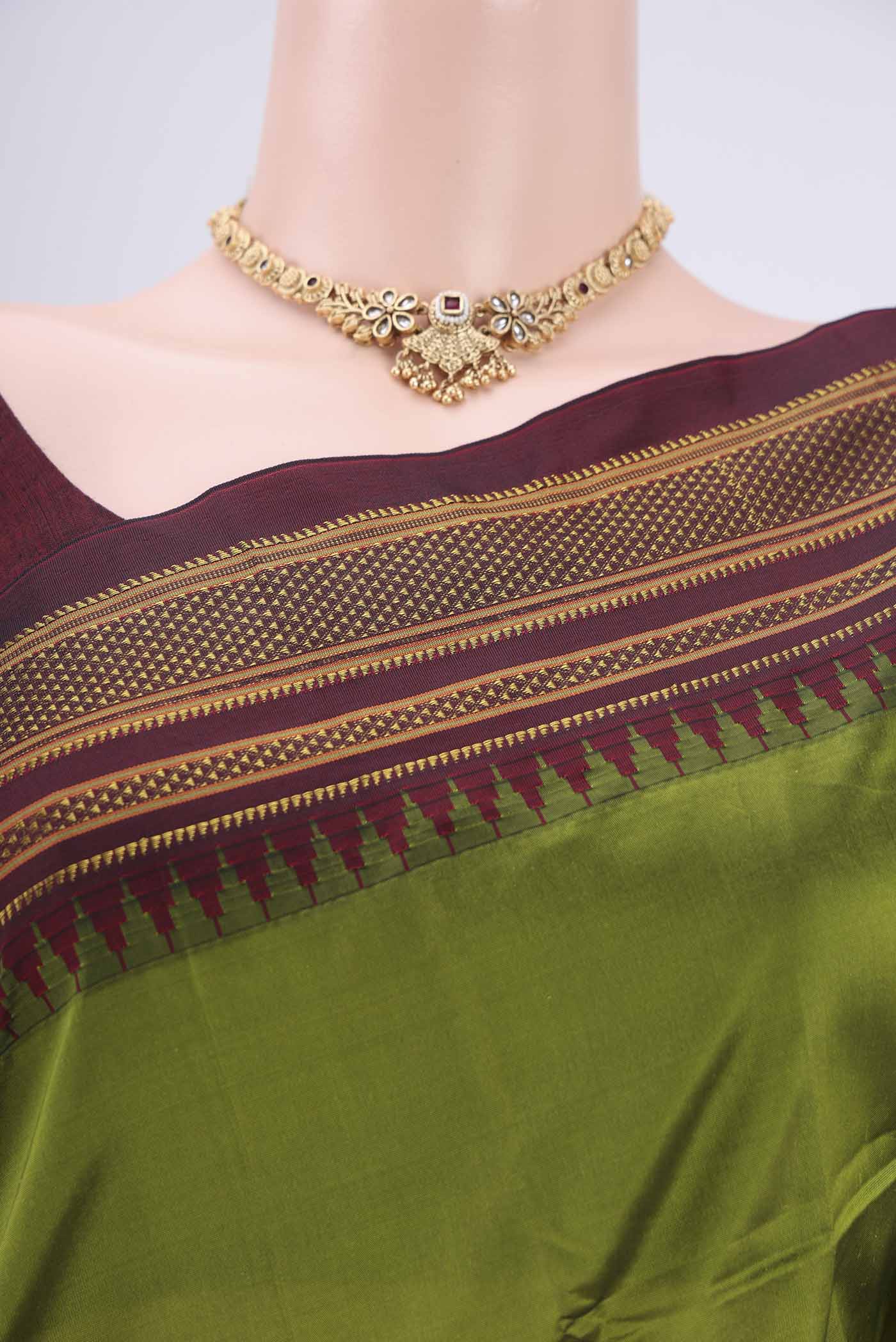 Border image of Green Blended Bangalore Silk Saree with Plain Body and Temple Border. 