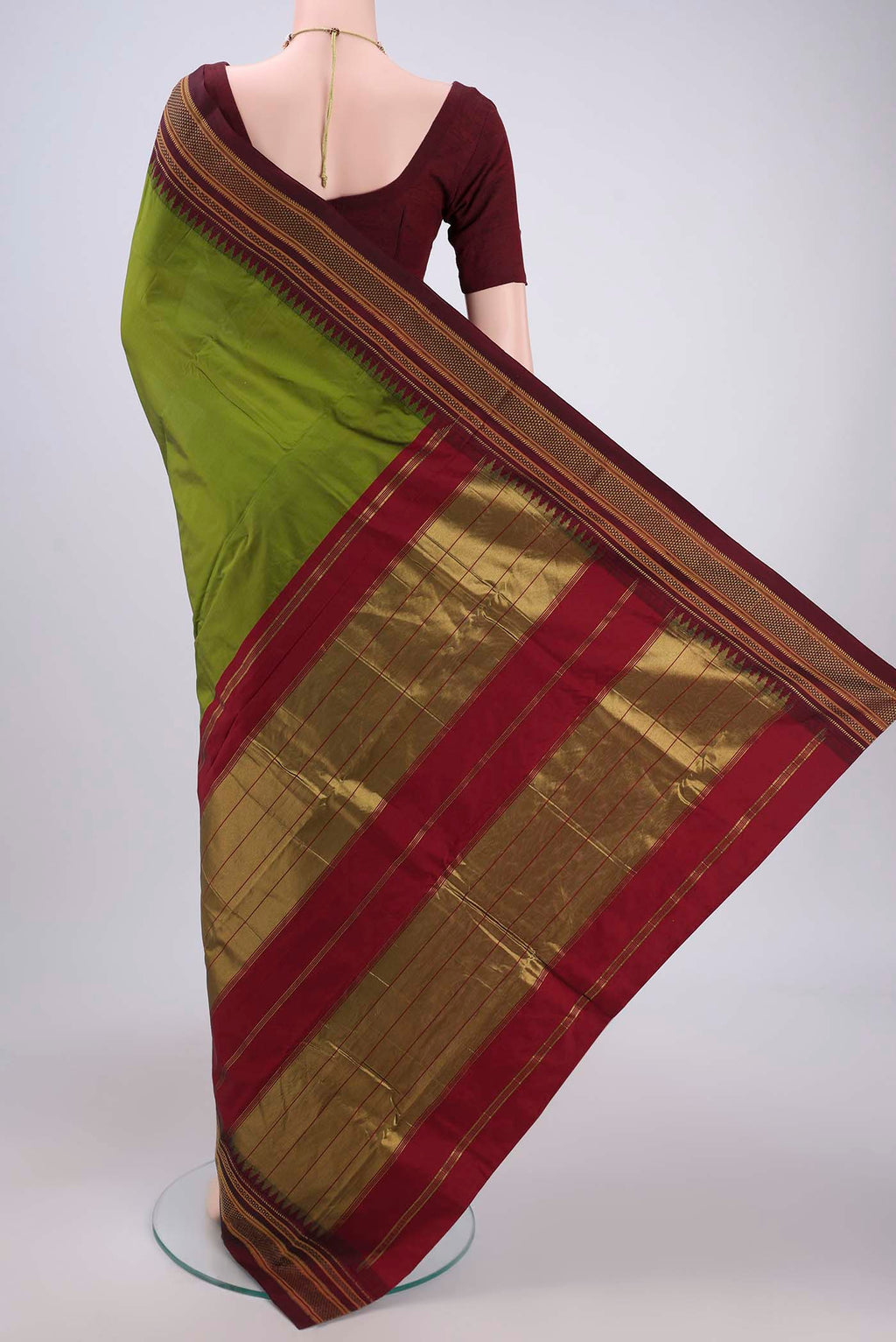 Flat view of Green Blended Bangalore Silk Saree with Plain Body and Temple Border. 