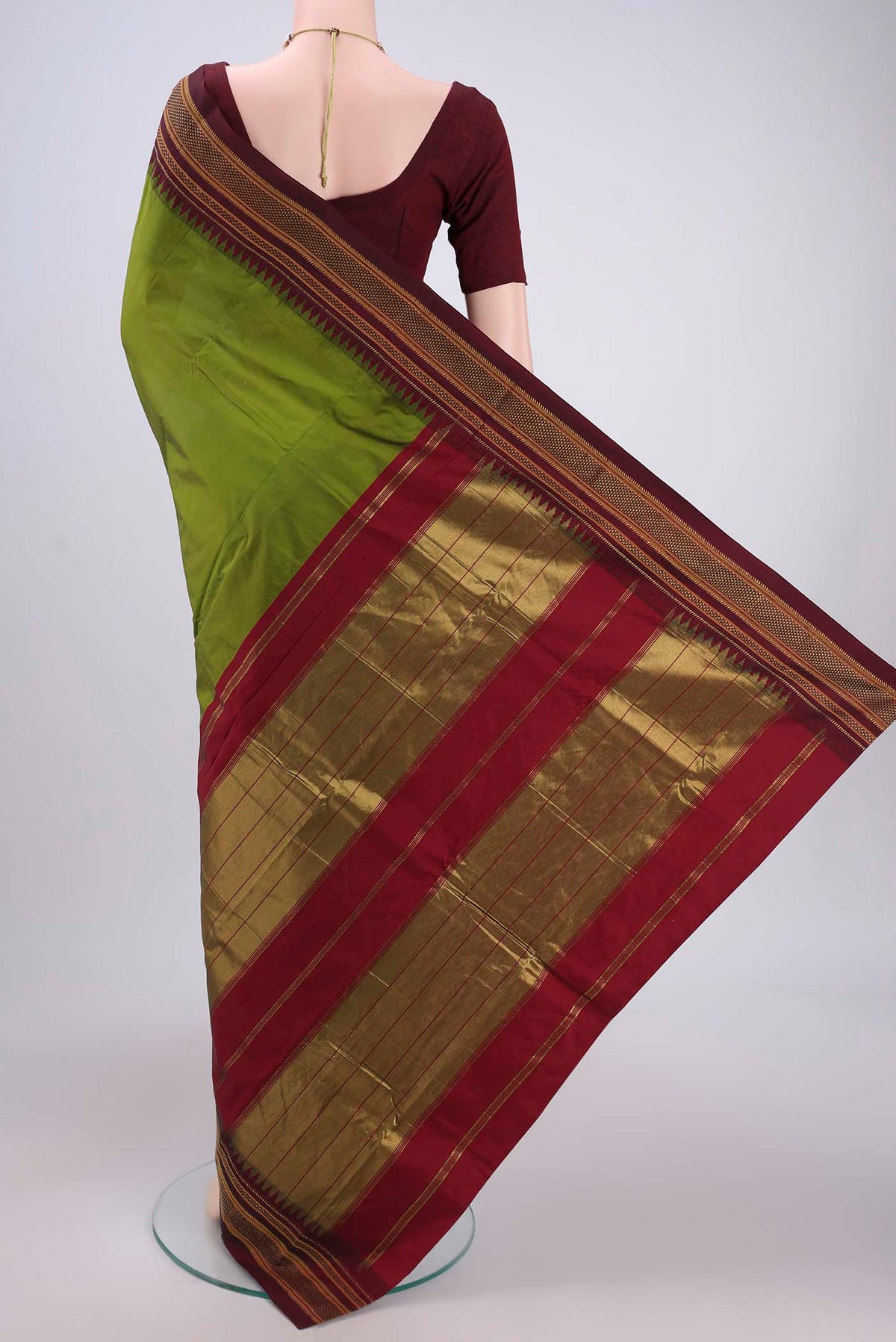 Flat view of Green Blended Bangalore Silk Saree with Plain Body and Temple Border. 