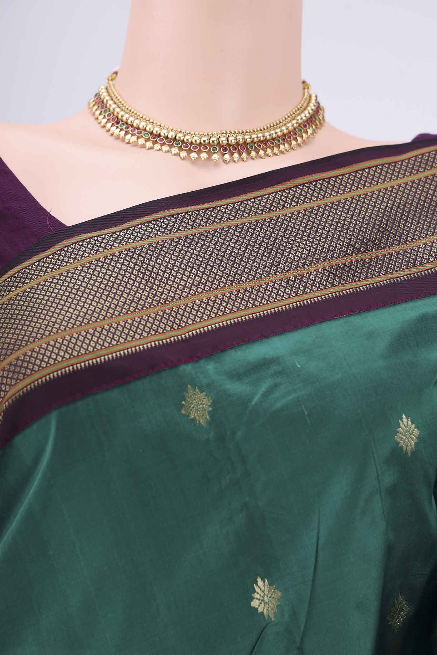 Border image of Bottle Green Blended Bangalore Silk Saree with Zari Butta on the body and Zari Border. 